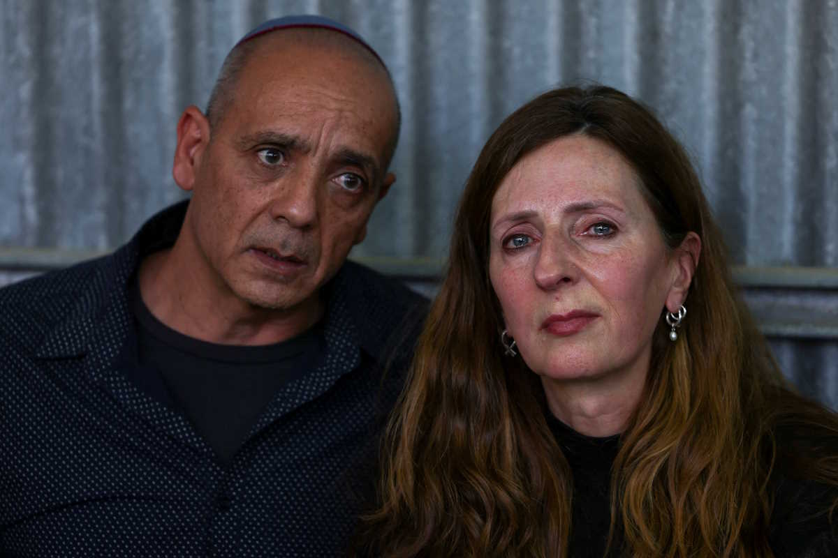 Parents of German-Israeli Shani Louk, who was killed in the October 7 attack by Palestinian Islamist group Hamas, react during her funeral in Srigim, Israel, May 19, 2024, after Louk's body was retrieved from Gaza. REUTERS