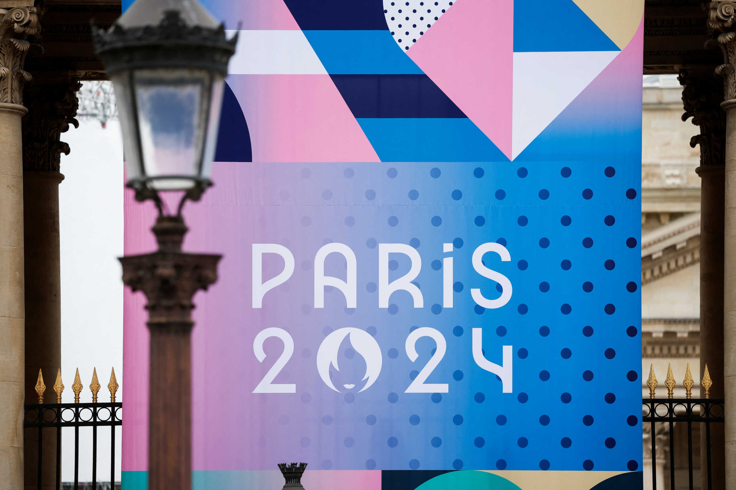 The logo of the Paris 2024 Olympic and Paralympic Games is pictured in front of the National Assembly in Paris, France, May 2, 2024. REUTERS