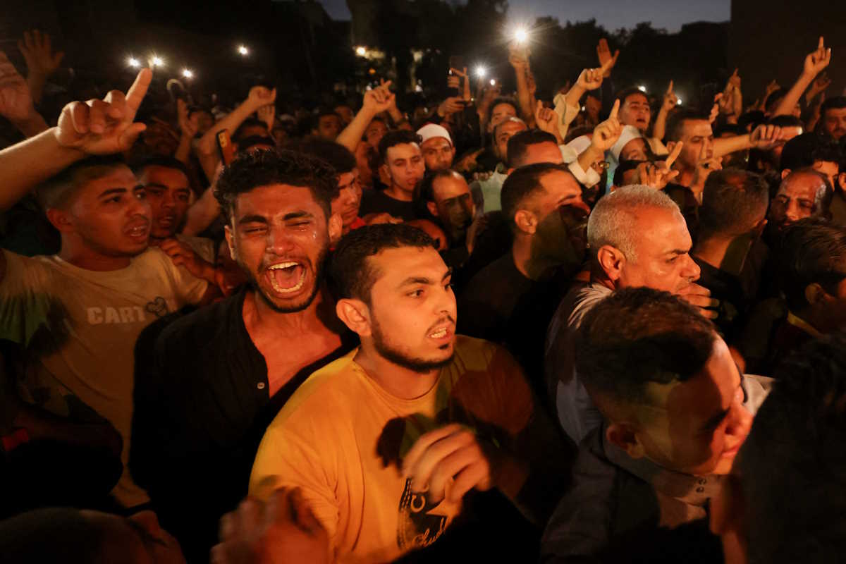 People react during the funeral of Islam Ibrahim Abdel Razeq, Egyptian army soldier killed in Rafah, in his hometown, in Fayoum, Egypt, May 28, 2024. REUTERS