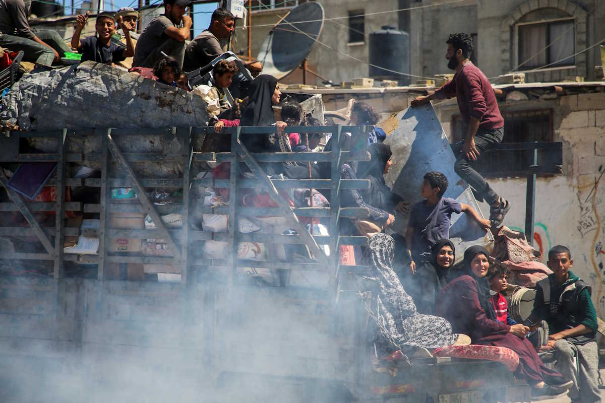 Palestinians travel in a truck as they flee Rafah after Israeli forces launched a ground and air operation in the eastern part of the southern Gaza city, amid the ongoing conflict between Israel and Hamas, in Rafah, in the southern Gaza Strip May 8, 2024. REUTERS