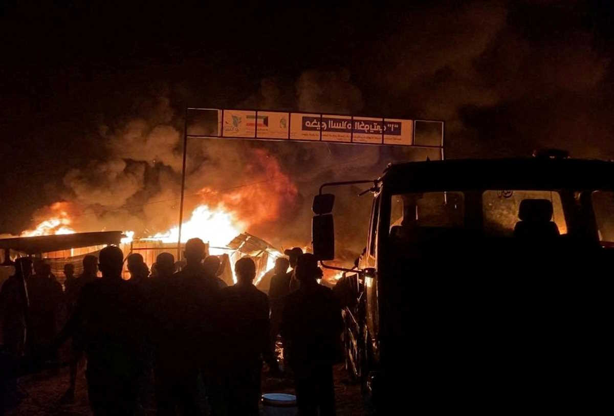 Fire rages following an Israeli strike on an area designated for displaced Palestinians, amid the ongoing conflict between Israel and Hamas, in Rafah in the southern Gaza Strip, in this still picture taken from a video, May 26, 2024. REUTERS