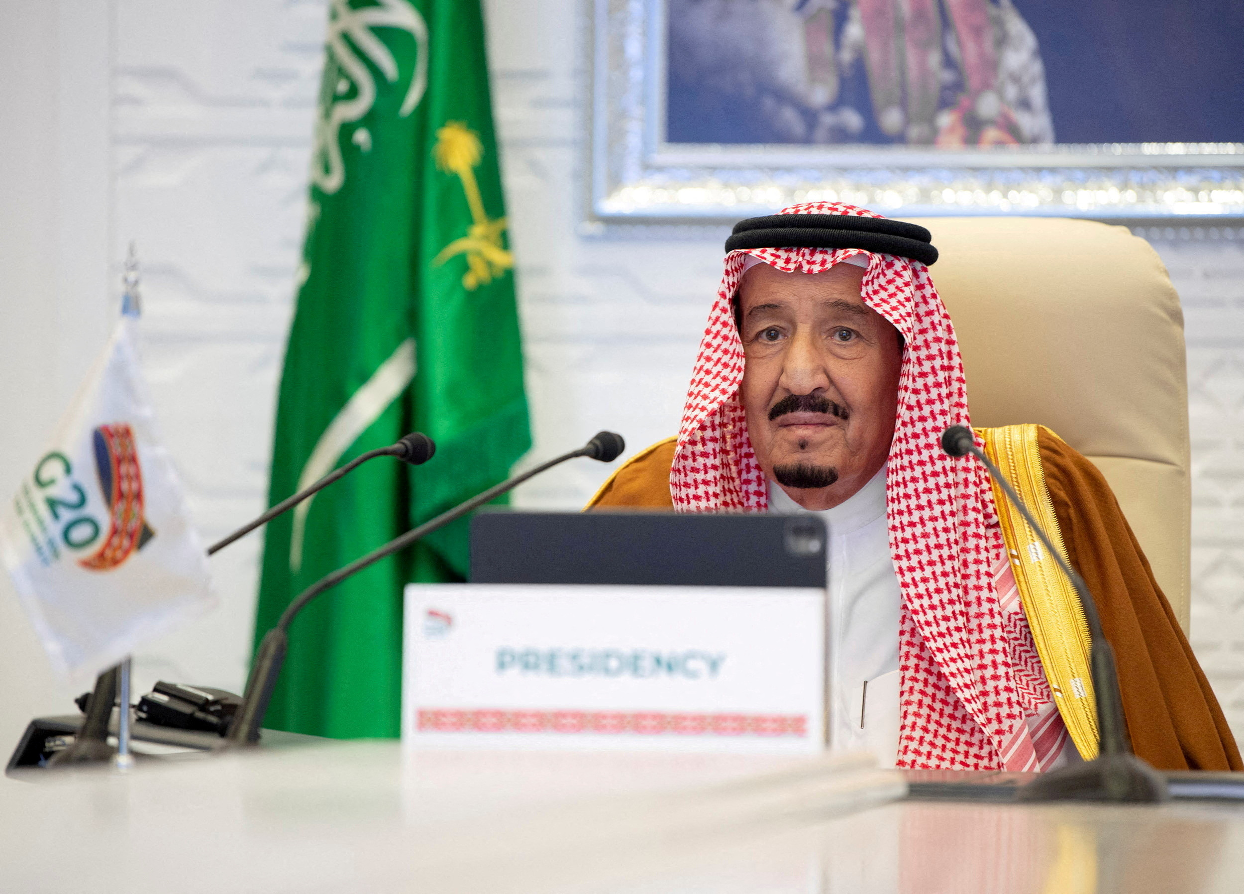 FILE PHOTO: Saudi King Salman bin Abdulaziz gives a virtual speech during an opening session of the 15th annual G20 Leaders' Summit in Riyadh, Saudi Arabia, November 21, 2020. Courtesy of Bandar Algaloud