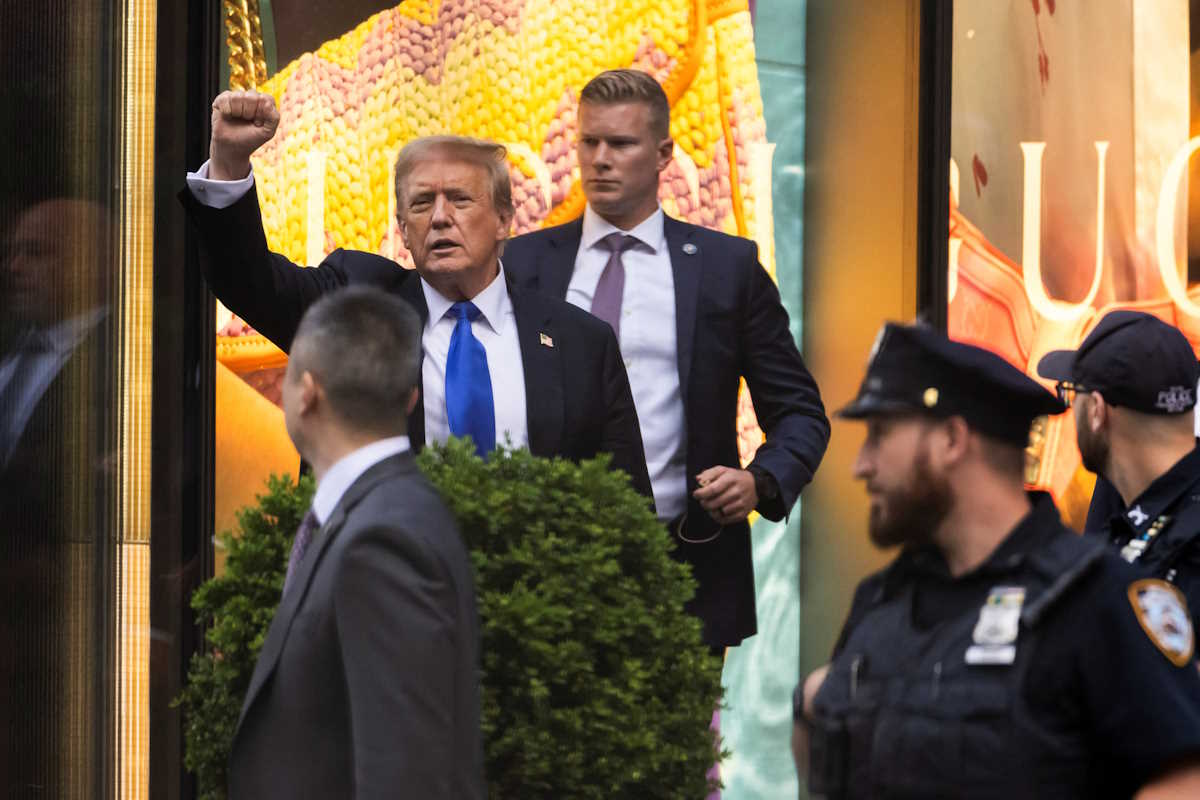 Former U.S. President Donald Trump's gestures following the announcement of the verdict of his criminal trial over charges that he falsified business records to conceal money paid to silence porn star Stormy Daniels in 2016, outside Trump Tower, in New York City, U.S. May 30, 2024. REUTERS
