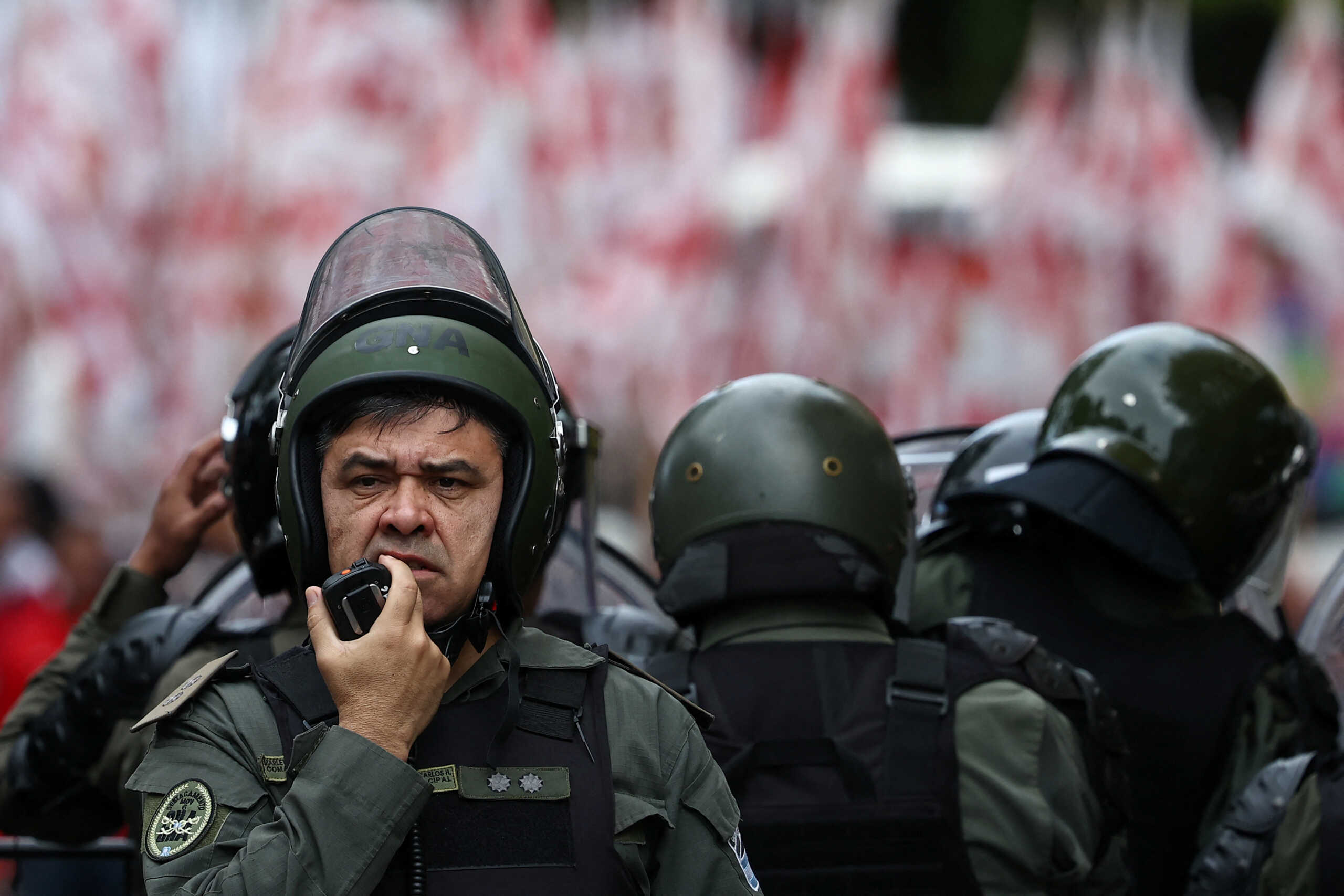 Members of the Argentine National Gendarmerie stand guard while social groups protest against Argentina's President Javier Milei's adjustment policy, elimination of social programs and lack of assistance to soup kitchens, as they march towards Olivos Presidential residence, in Buenos Aires, Argentina, May 7, 2024. REUTERS