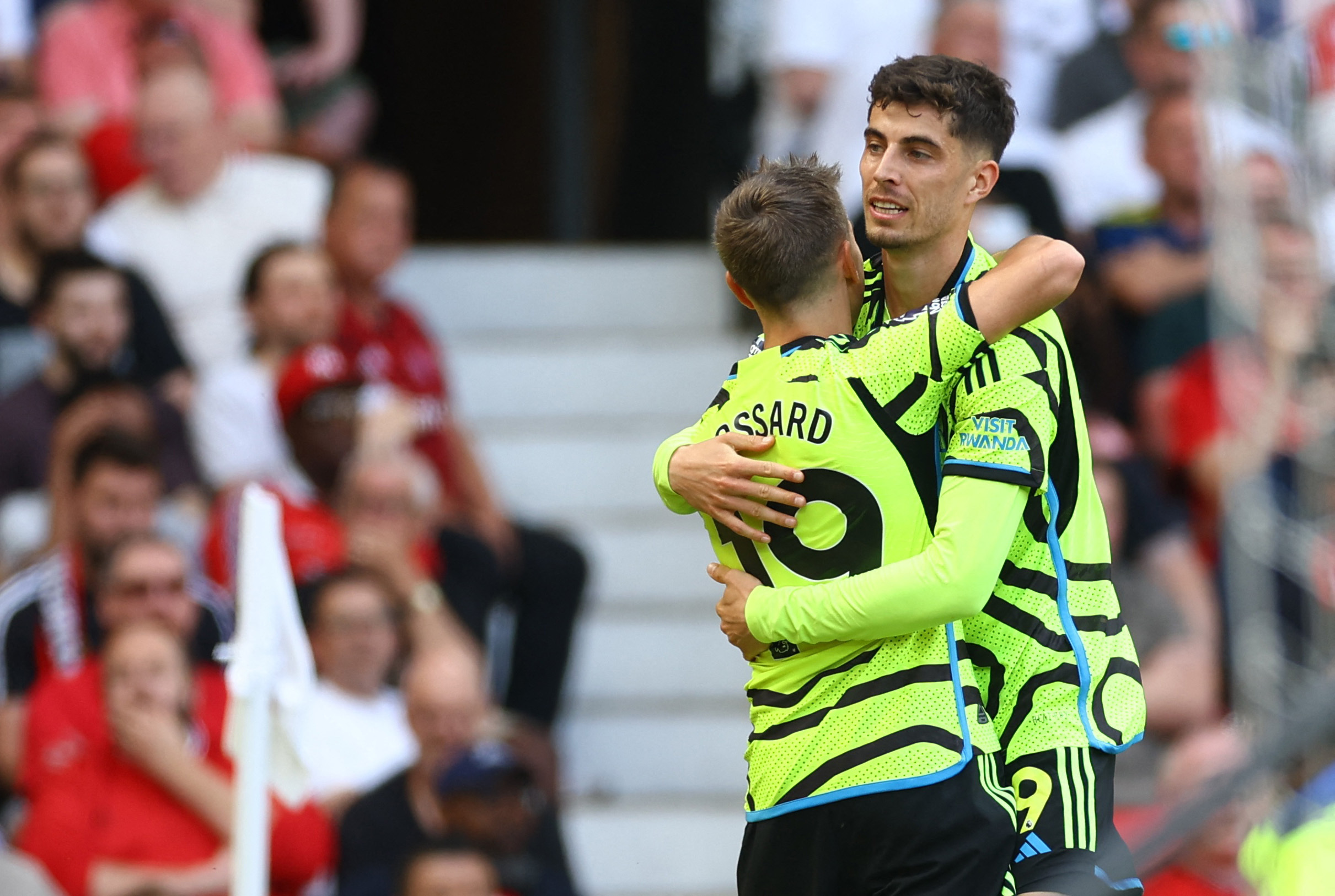 Soccer Football - Premier League - Manchester United v Arsenal - Old Trafford, Manchester, Britain - May 12, 2024 Arsenal's Leandro Trossard celebrates scoring their first goal with Kai Havertz REUTERS