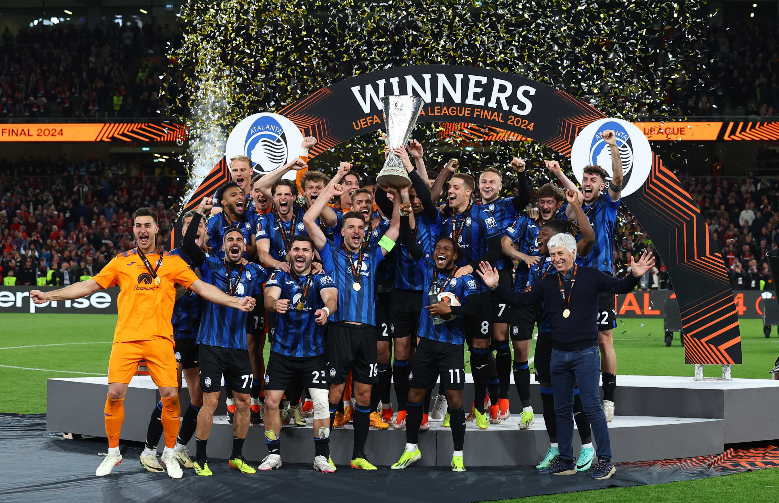 Soccer Football - Europa League - Final - Atalanta v Bayer Leverkusen - Aviva Stadium, Dublin, Ireland - May 22, 2024 Atalanta's Berat Djimsiti and Ademola Lookman lift the trophy with teammates after winning the Europa League Final REUTERS