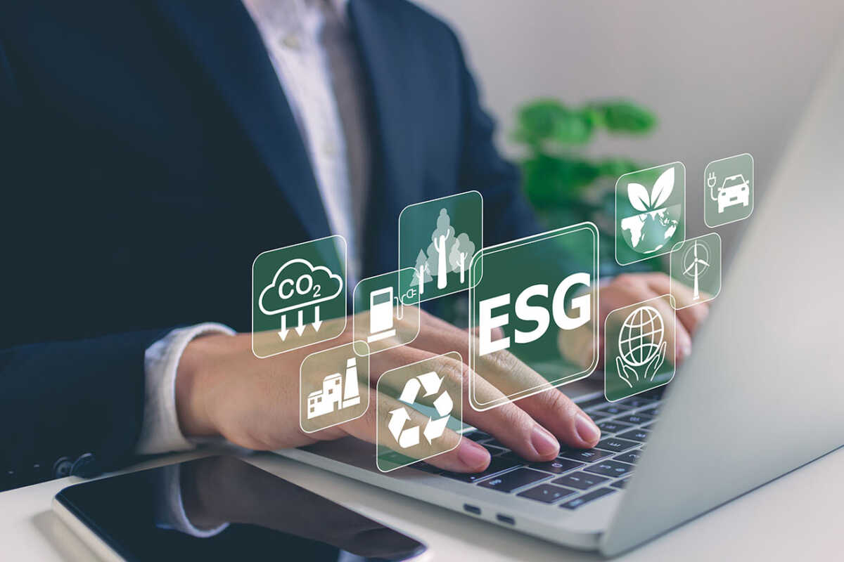 Businessman use a laptop to analyze investment ESG by ESG icons.ESG environment concept.close to the computer screen in business investment strategy concept.