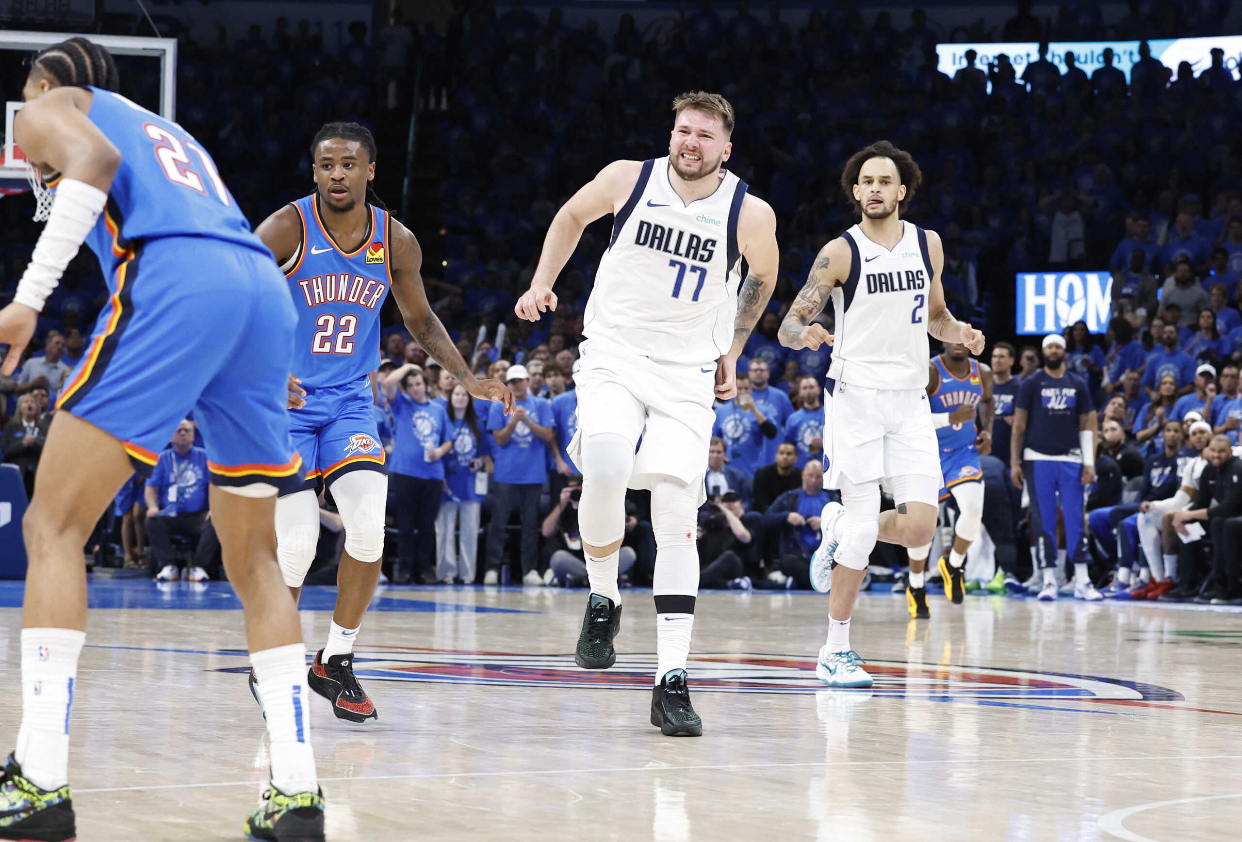 May 9, 2024; Oklahoma City, Oklahoma, USA; Dallas Mavericks guard Luka Doncic (77) limps down the court after a play against the Oklahoma City Thunder during the second half of game two of the second round for the 2024 NBA playoffs at Paycom Center. Mandatory Credit: Alonzo Adams-USA TODAY Sports