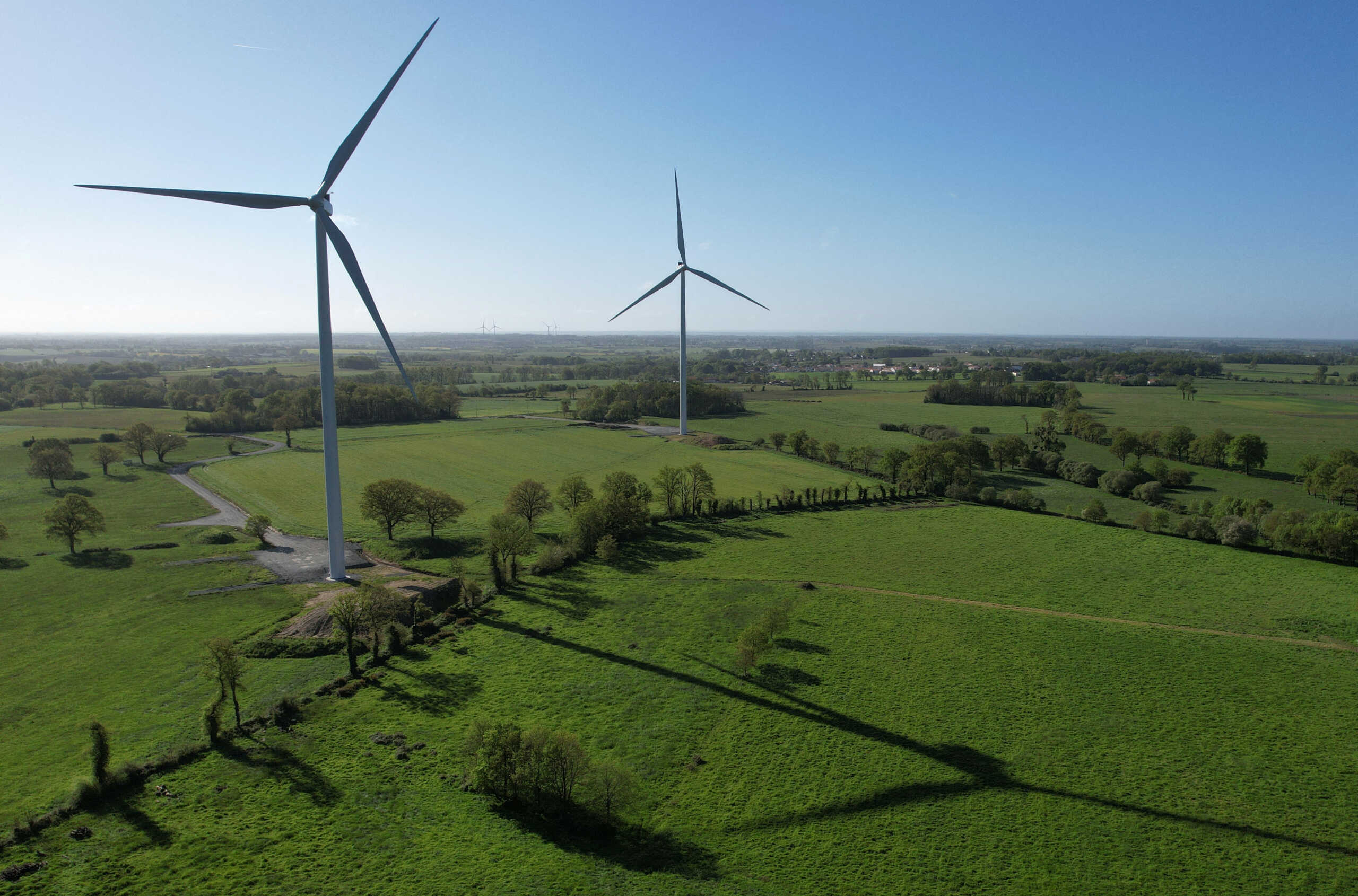 A drone view shows power-generating windmill turbines at a wind park in La Regrippiere, near Nantes, France, April 17, 2024. REUTERS