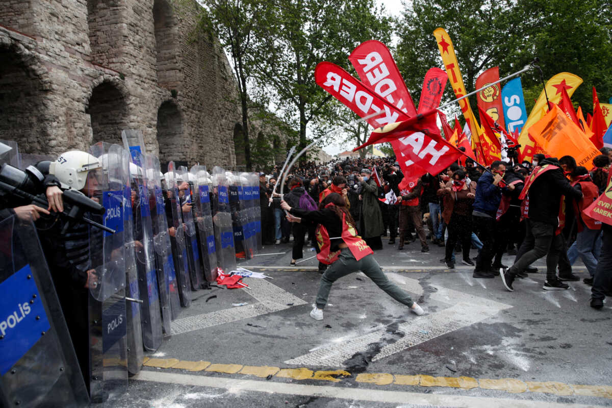 Protesters scuffle with riot police as they attempt to defy a ban and march on Taksim Square to celebrate May Day in Istanbul, Turkey May 1, 2024. REUTERS