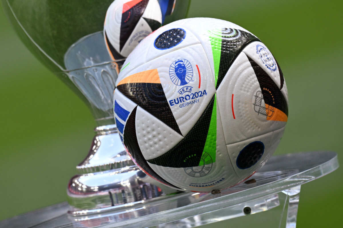 Soccer Football - Euro 2024 - Trophy Display at Allianz Arena, Munich, Germany - May 13, 2024 General view of the Fussballliebe match ball on display next to the European Championship trophy during the presentation REUTERS