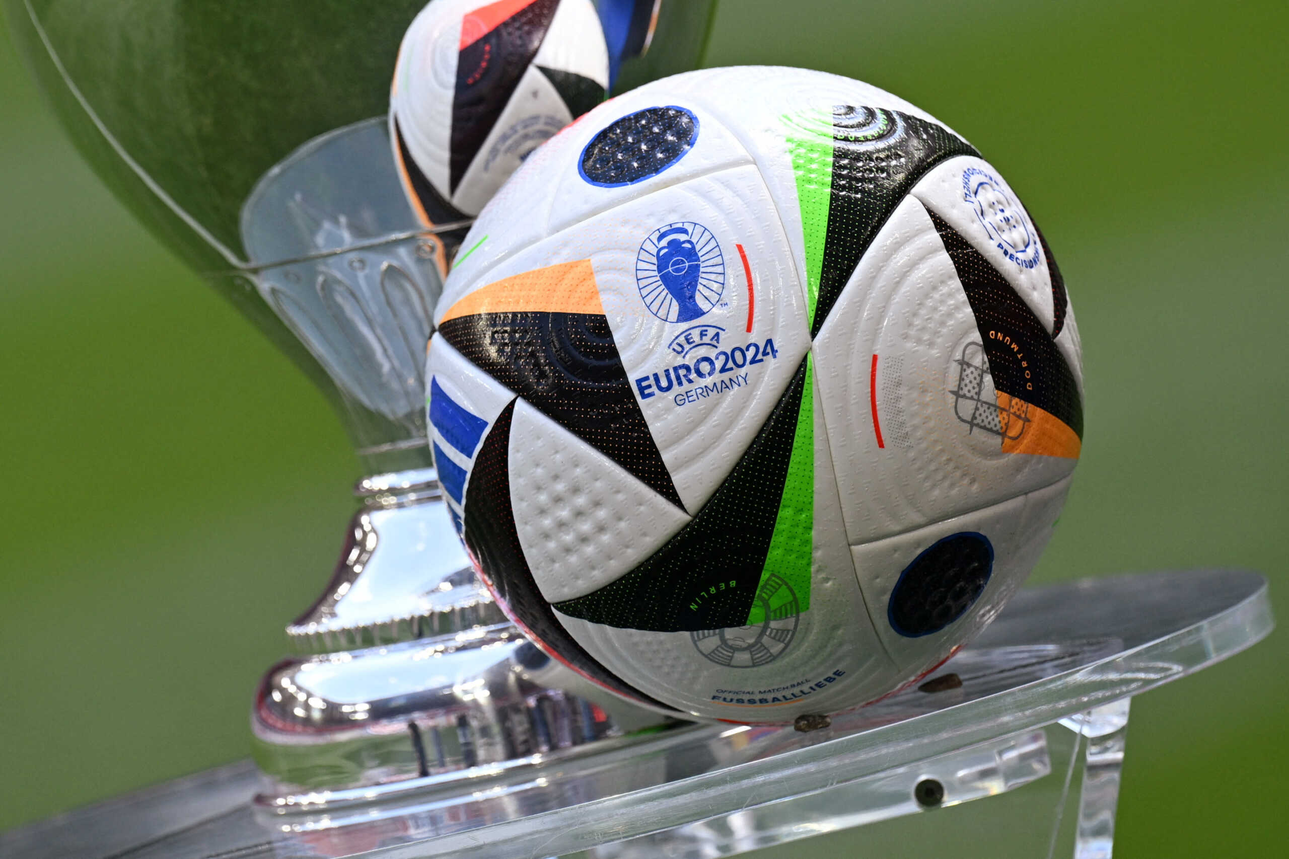 Soccer Football - Euro 2024 - Trophy Display at Allianz Arena, Munich, Germany - May 13, 2024 General view of the Fussballliebe match ball on display next to the European Championship trophy during the presentation REUTERS