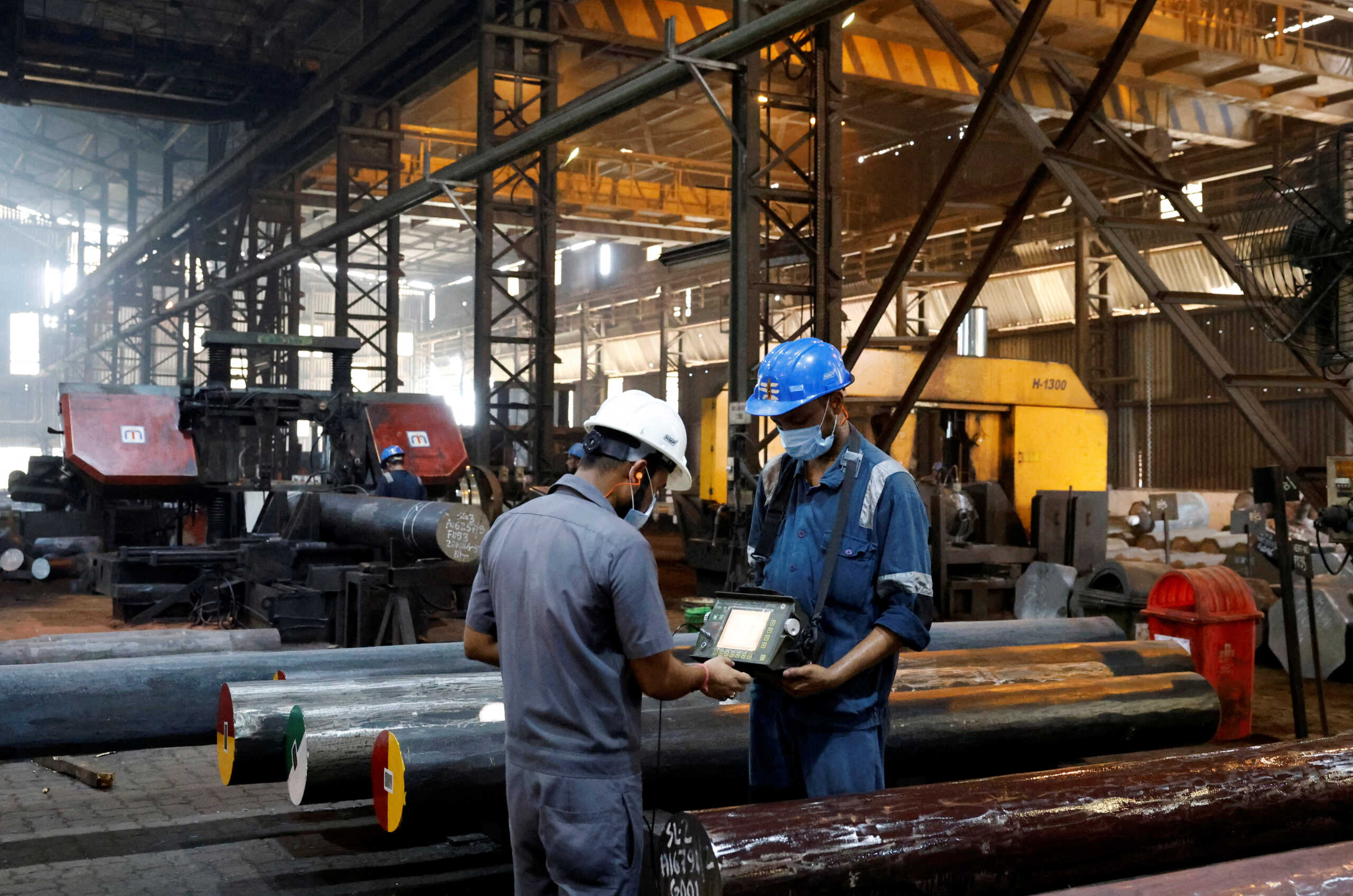 Employees conduct a quality check of ultrasonic soundness of the forged bars on a machine, inside the ArcVac ForgeCast factory, in Hooghly district, in the eastern state of West Bengal, India, April 26, 2024. REUTERS