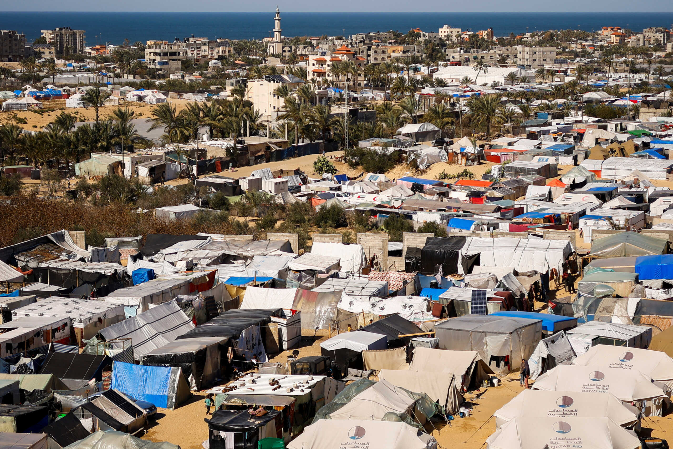 Displaced Palestinians, who fled their houses due to Israeli strikes, shelter at a tent camp, amid the ongoing conflict between Israel and the Palestinian Islamist group Hamas, in Rafah in the southern Gaza Strip, February 29, 2024. REUTERS