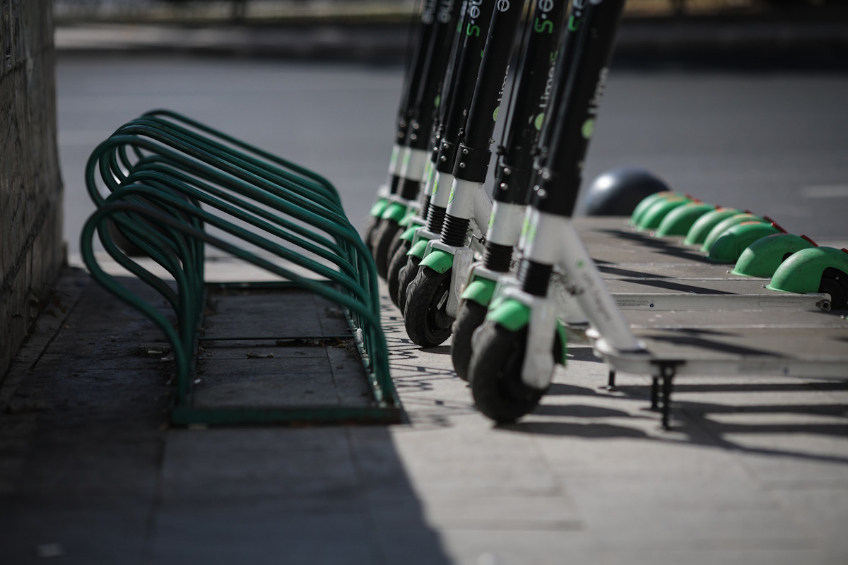 Bucharest, Romania - September 22, 2019: Lime electric scooters one next to another in downtown Bucharest.