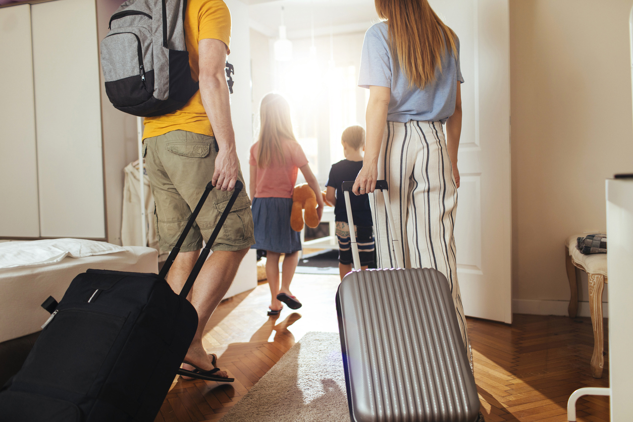 Shot of a happy family leaving their home for a vacation