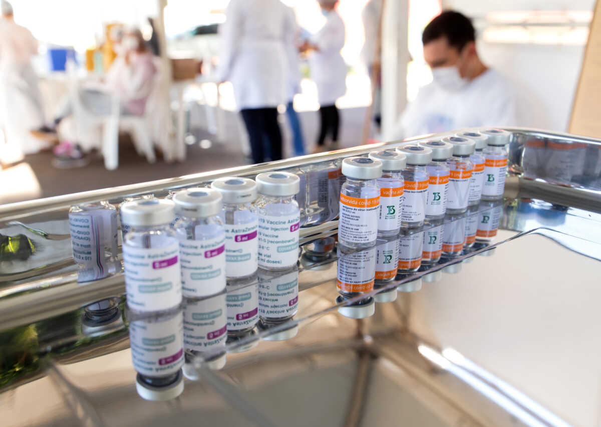 Coronavirus vaccine bottles lined up on a stainless steel tray ready to be used in a vaccination campaign in Apucarana, Paraná