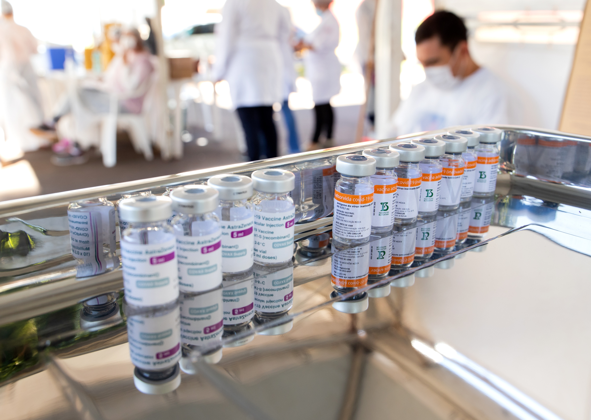 Coronavirus vaccine bottles lined up on a stainless steel tray ready to be used in a vaccination campaign in Apucarana, Paraná