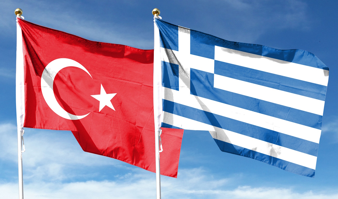 Türkiye flag and Greece flag on cloudy sky. fluttering in the sky