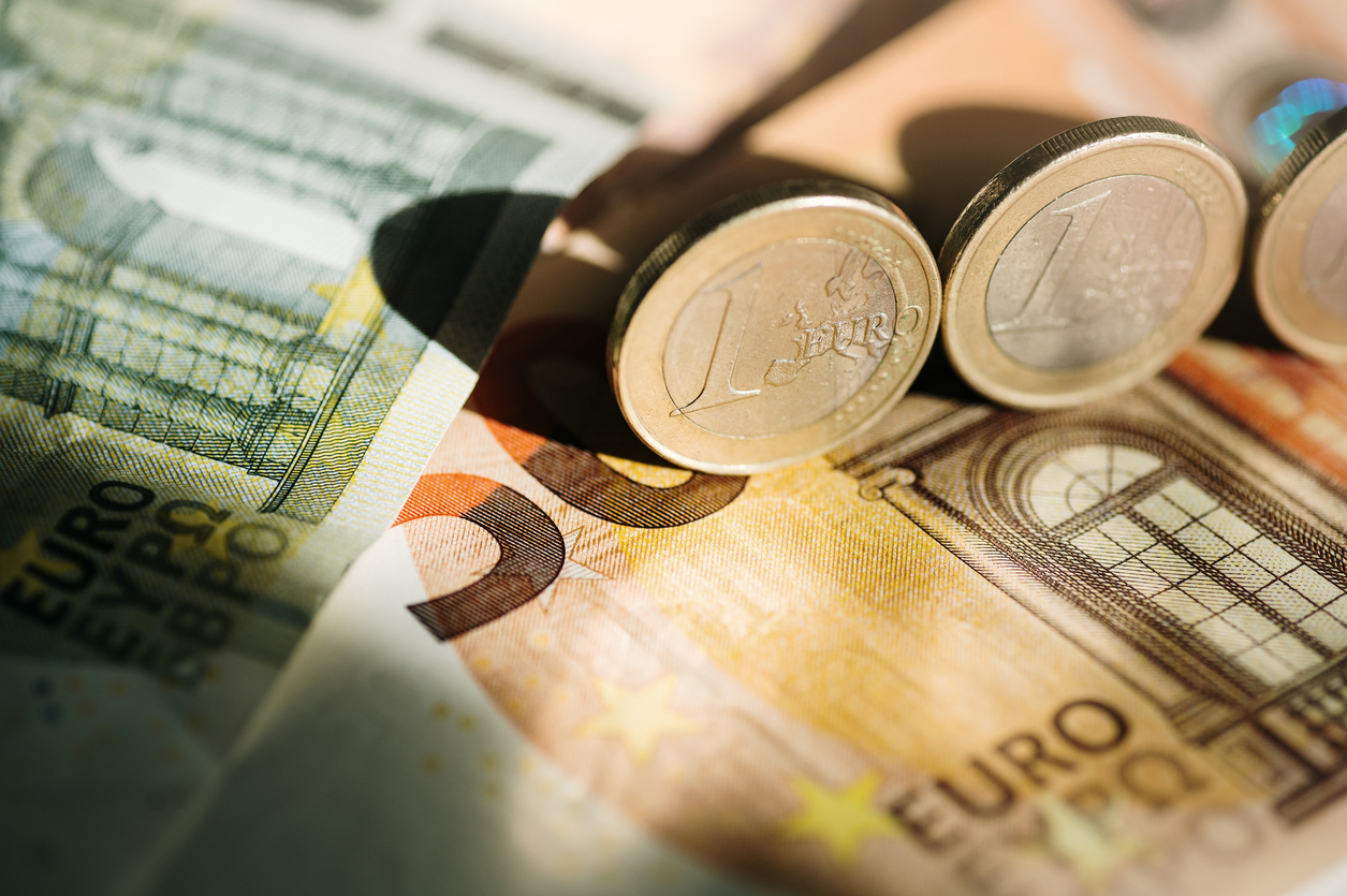 Detail of euro coins and banknotes