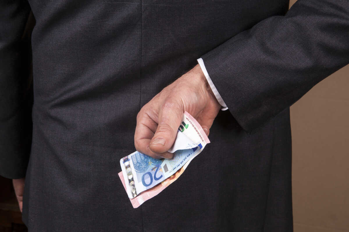 Banknotes behind his back