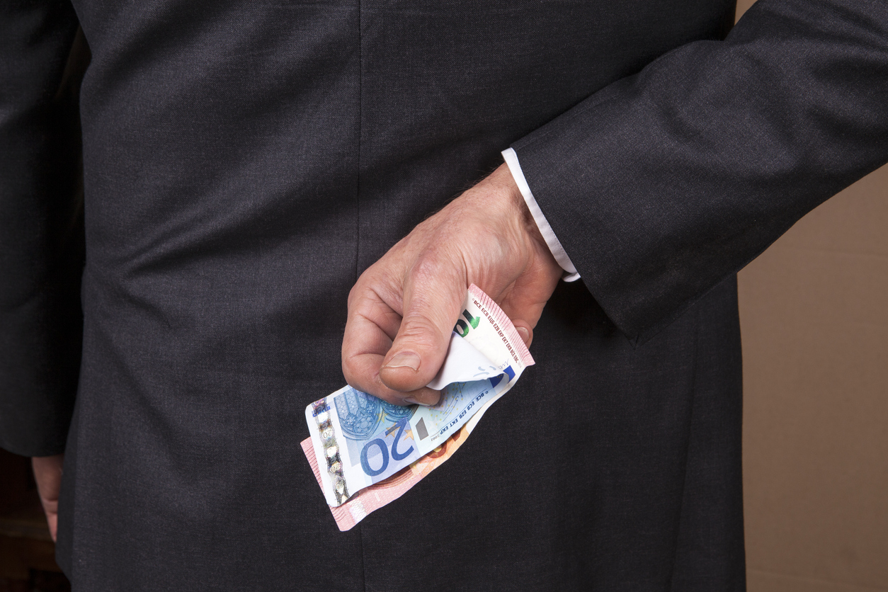 Banknotes behind his back