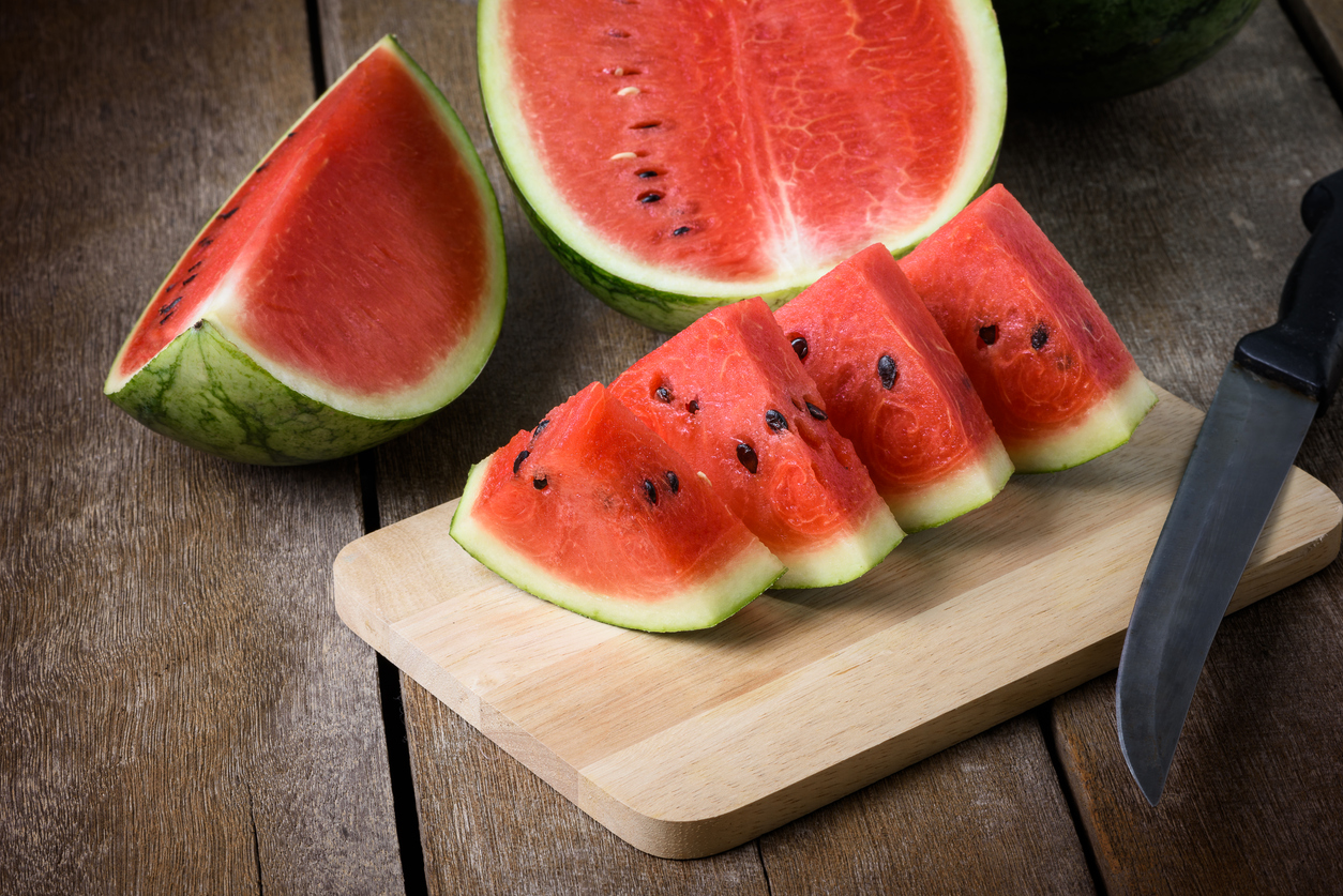 Fresh sliced watermelon wooden background