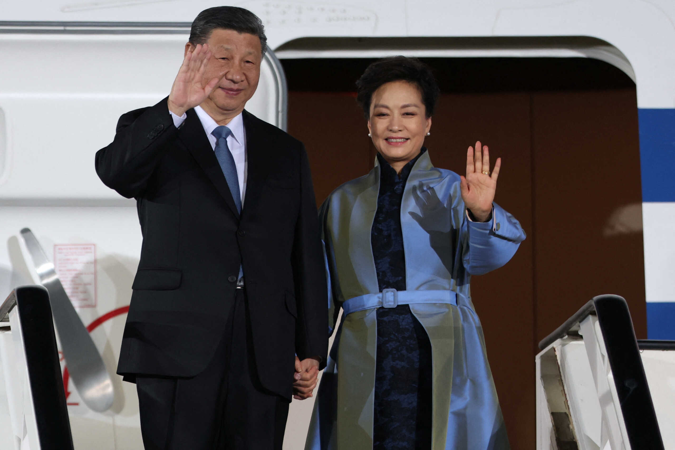 China's President Xi Jinping and his wife Peng Liyuan wave upon their arrival for an official two-day state visit, at Nikola Tesla Airport in Belgrade, Serbia, May 7, 2024. REUTERS