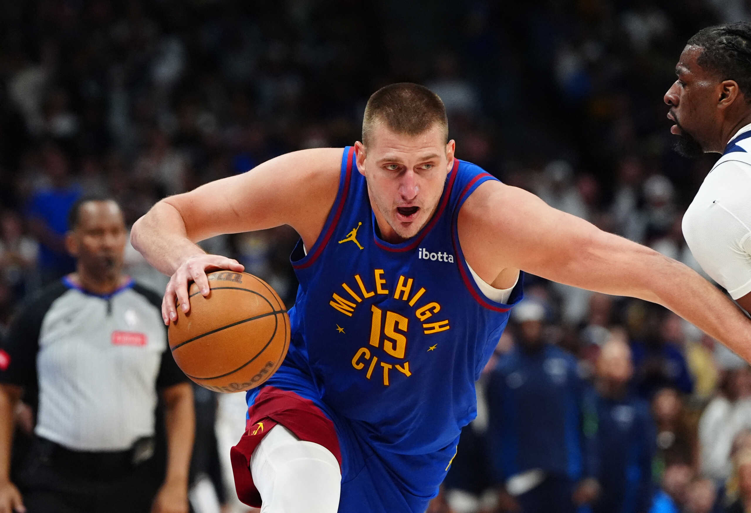 May 4, 2024; Denver, Colorado, USA; Denver Nuggets center Nikola Jokic (15) controls the ball in the second half against the Minnesota Timberwolves during game one of the second round for the 2024 NBA playoffs at Ball Arena. Mandatory Credit: Ron Chenoy-USA TODAY Sports