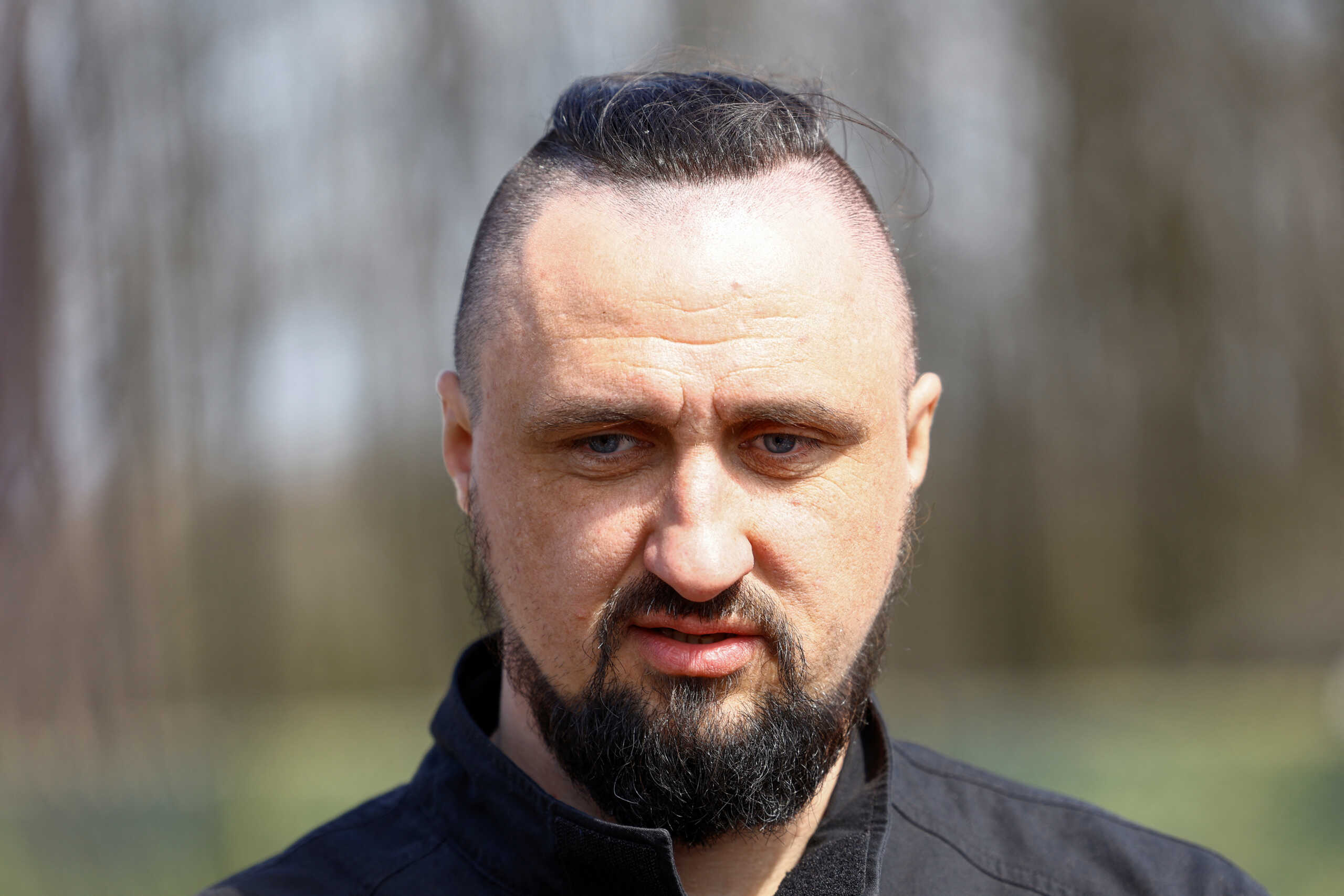 Ukrainian Strategic Industries Minister Oleksandr Kamyshin speaks to the media during an exhibition of military equipment and weapons, amid Russia's attack on Ukraine, at an undisclosed location in Ukraine April 13, 2024. REUTERS