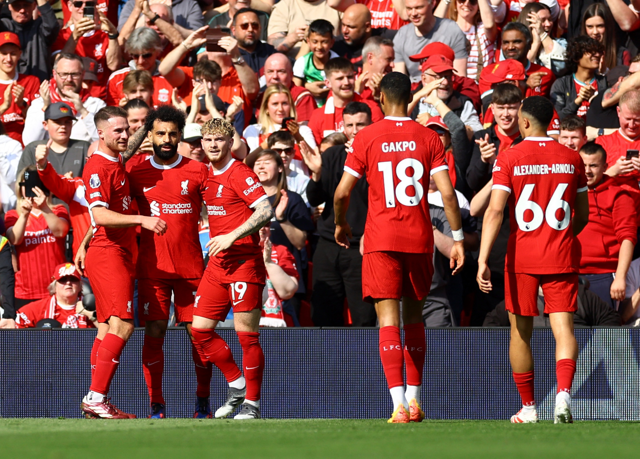 Soccer Football - Premier League - Liverpool v Tottenham Hotspur - Anfield, Liverpool, Britain - May 5, 2024 Liverpool's Mohamed Salah celebrates scoring their first goal with Harvey Elliott and Alexis Mac Allister REUTERS