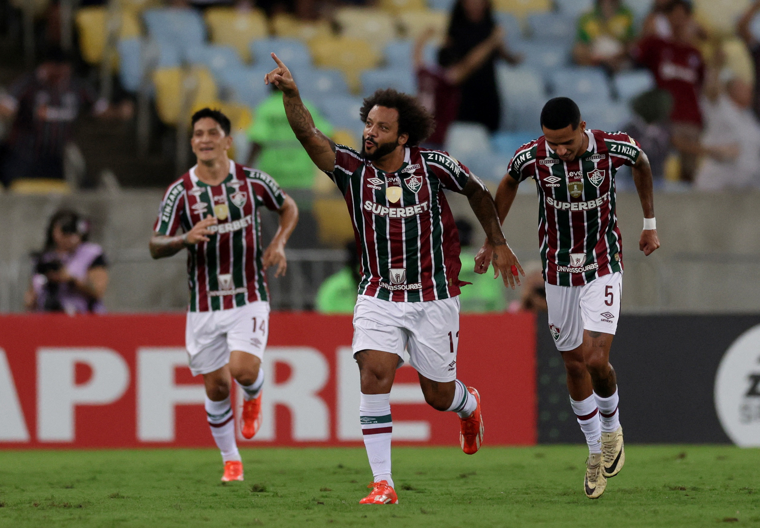 Soccer Football - Copa Libertadores - Group A - Fluminense v Cerro Porteno - Estadio Maracana, Rio de Janeiro, Brazil - May 16, 2024 Fluminense's Marcelo celebrates scoring their first goal with teammates REUTERS
