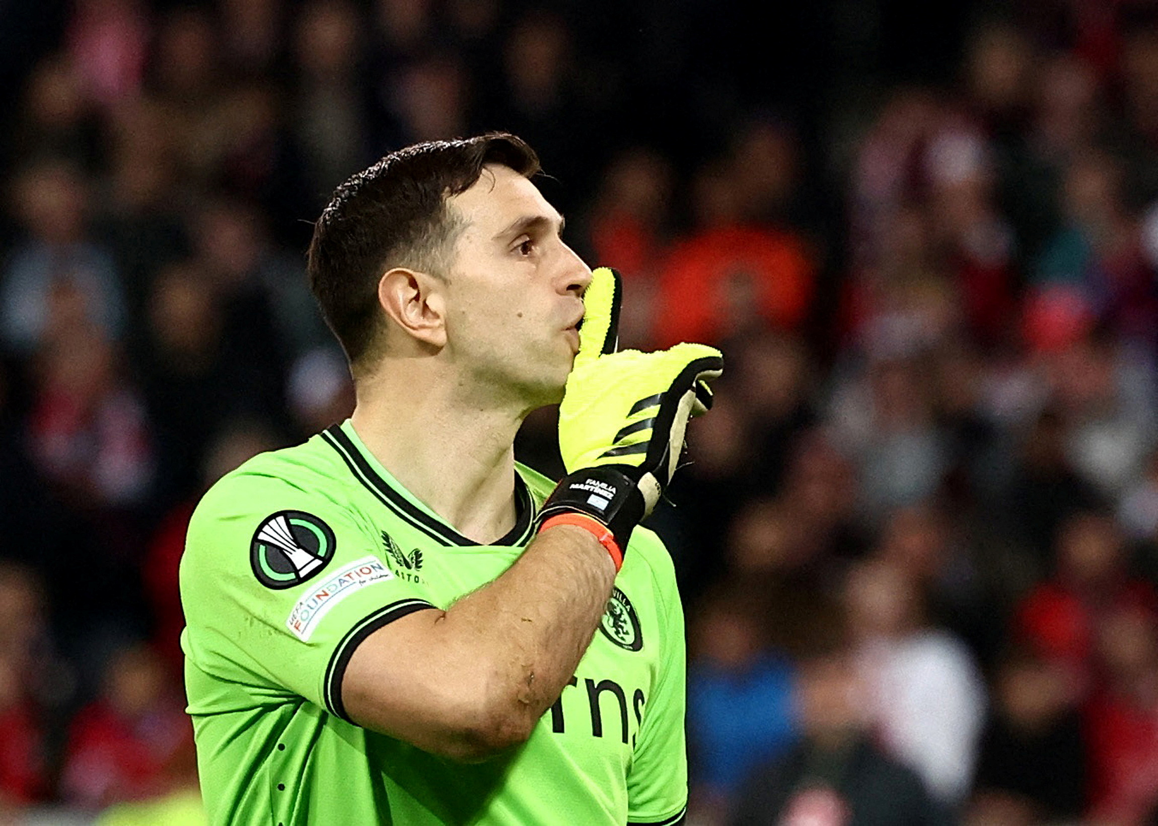 Soccer Football - Europa Conference League - Quarter Final - Second Leg - Lille v Aston Villa - Stade Pierre-Mauroy, Villeneuve-d'Ascq, France - April 18, 2024 Aston Villa's Emiliano Martinez celebrates saving Lille's Nabil Bentaleb penalty during the penalty shootout REUTERS