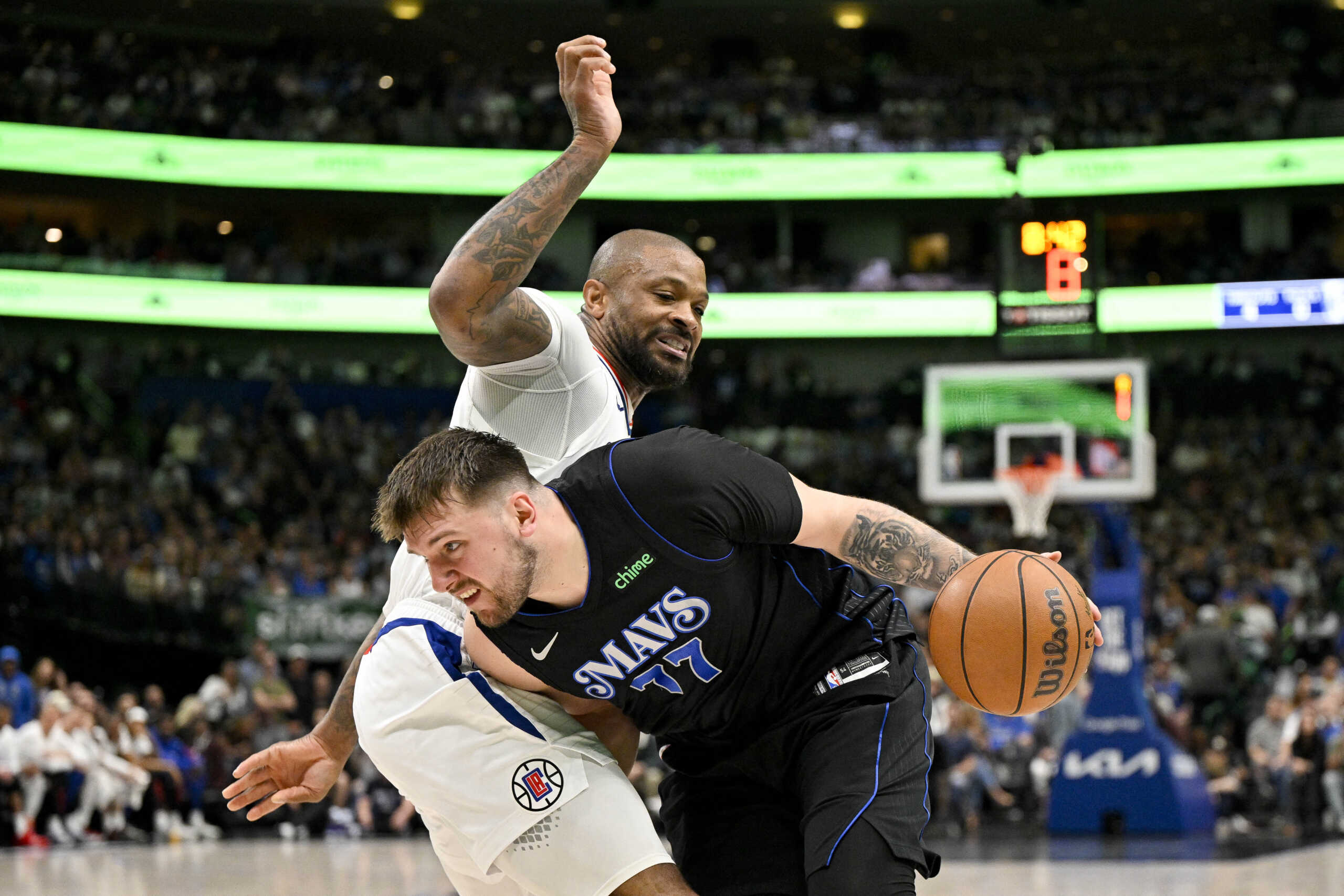 May 3, 2024; Dallas, Texas, USA; Dallas Mavericks guard Luka Doncic (77) drives to the basket past LA Clippers forward P.J. Tucker (17) during the third quarter during game six of the first round for the 2024 NBA playoffs at American Airlines Center. Mandatory Credit: Jerome Miron-USA TODAY Sports