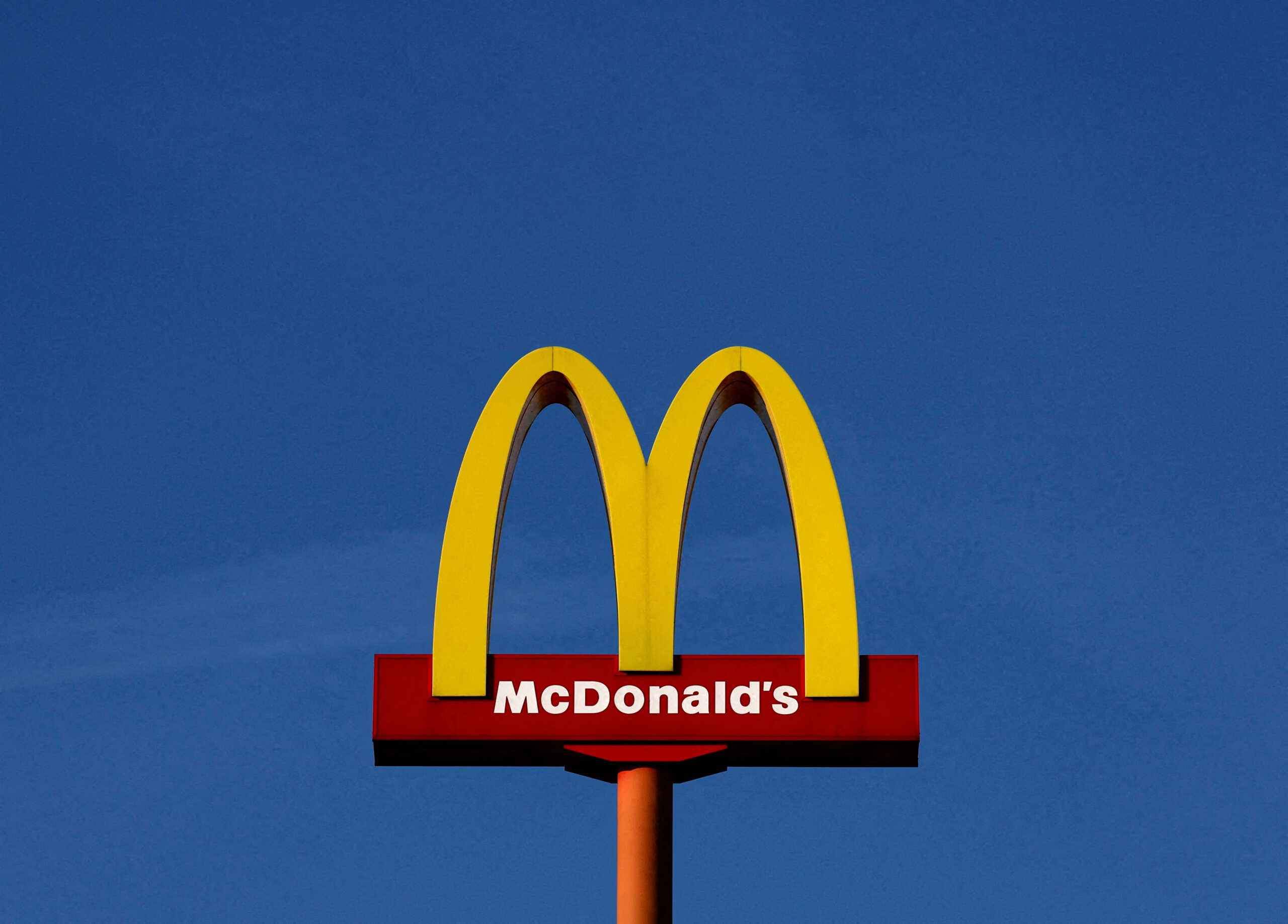 FILE PHOTO: A sign for the U.S. fast food restaurant chain McDonald's is seen outside one of their restaurants in Sint-Pieters-Leeuw, near Brussels, Belgium March 4, 2024. REUTERS
