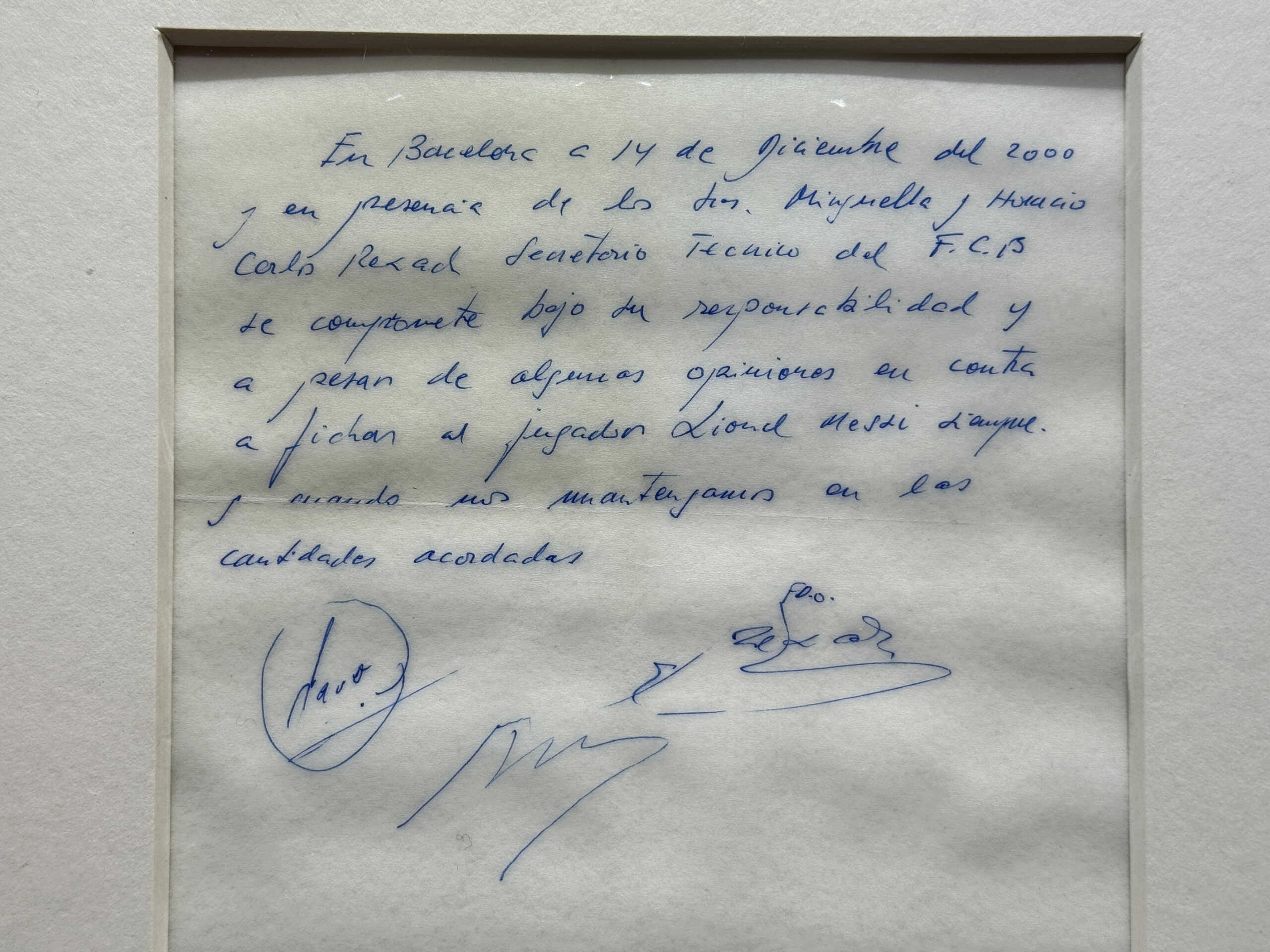 A signed and framed napkin on which soccer club Barcelona promised to sign a 13-year-old Lionel Messi is displayed at the Bonhams auction house in London, Britain May 8, 2024. REUTERS