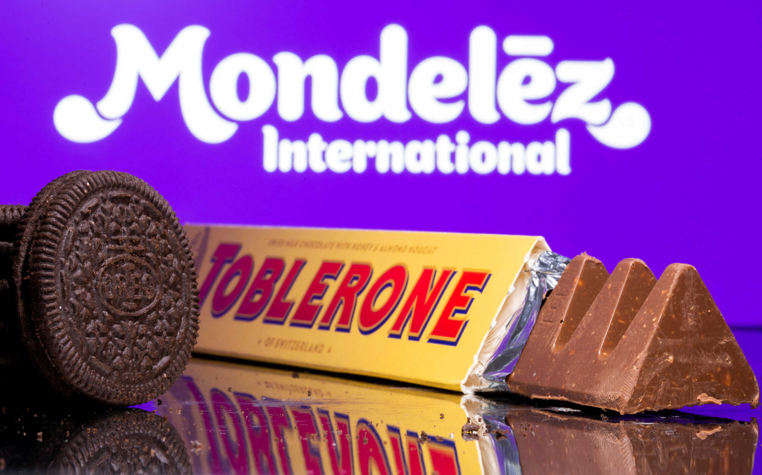 FILE PHOTO: Oreo biscuits and a Toblerone Swiss milk chocolate are seen displayed in front of Mondelez International logo in this illustration picture taken July 26, 2021. Picture taken July 26, 2021. REUTERS