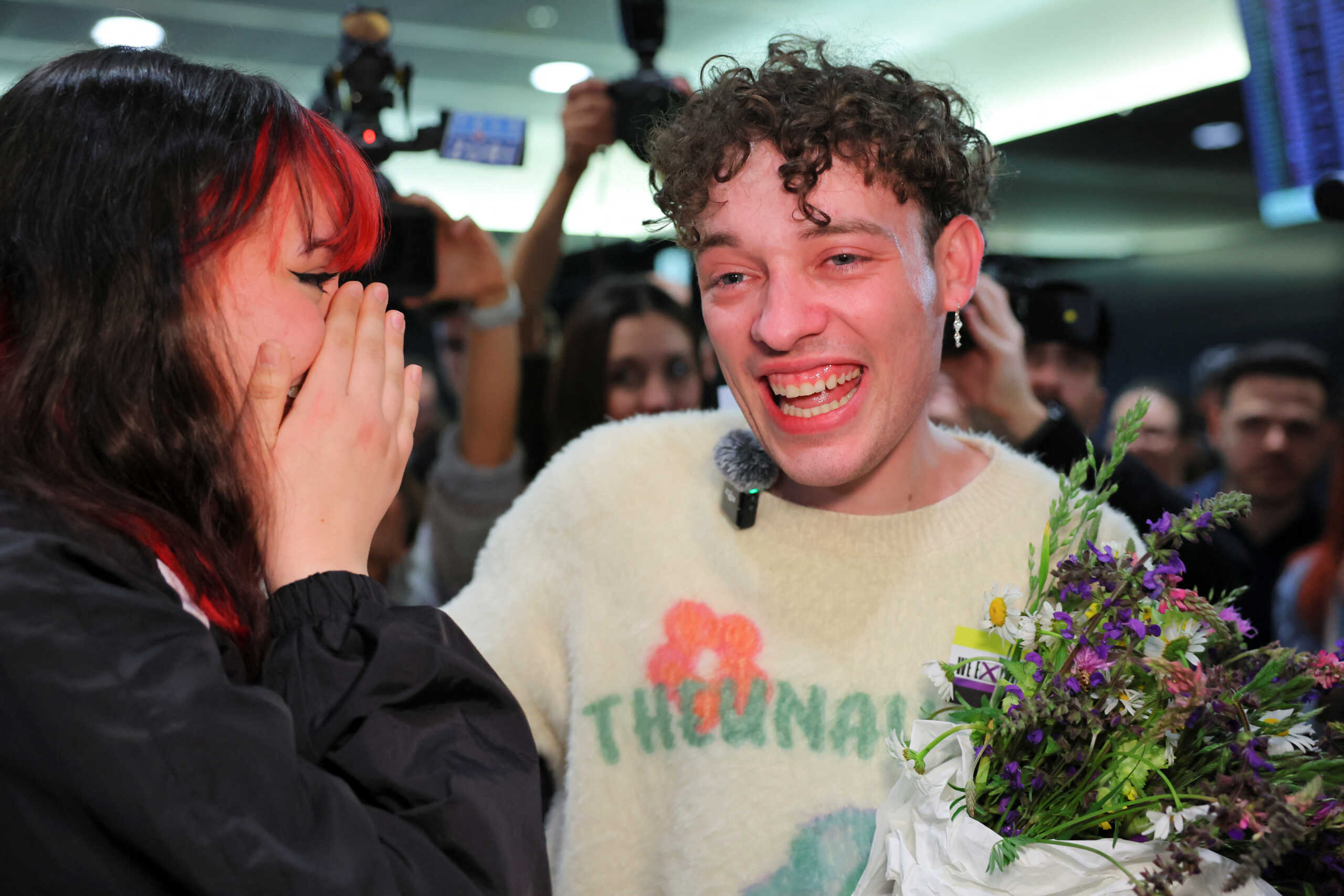 Swiss singer Nemo is welcomed by fans at the Zurich Airport after winning the 2024 Eurovision Song Contest, in Kloten, Switzerland, May 12, 2024. REUTERS