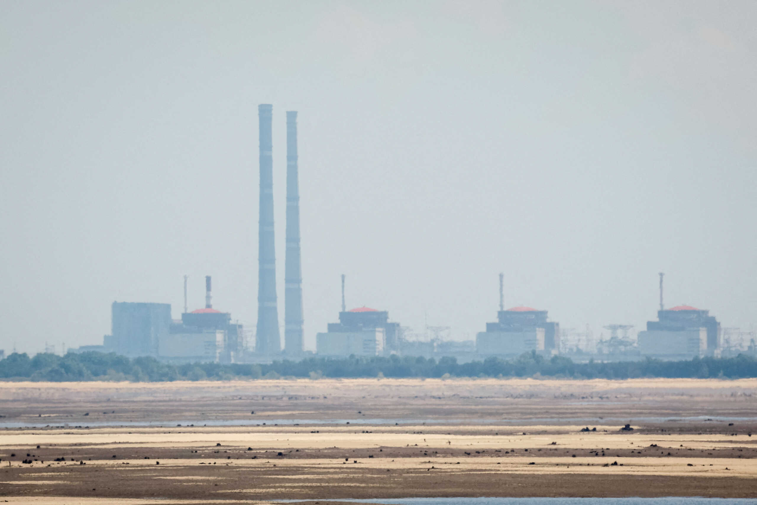 FILE PHOTO: A view shows Zaporizhzhia Nuclear Power Plant from the bank of Kakhovka Reservoir near the town of Nikopol after the Nova Kakhovka dam breached, amid Russia's attack on Ukraine, in Dnipropetrovsk region, Ukraine June 16, 2023. REUTERS