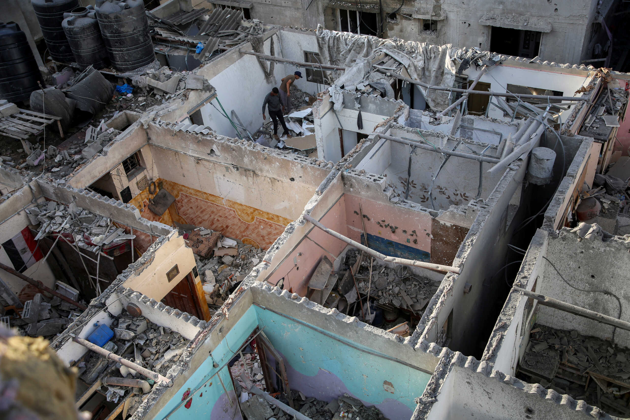 Palestinians inspect a house damaged in an Israeli strike, amid the ongoing conflict between Israel and the Palestinian Islamist group Hamas, in Rafah, in the southern Gaza Strip May 7, 2024. REUTERS
