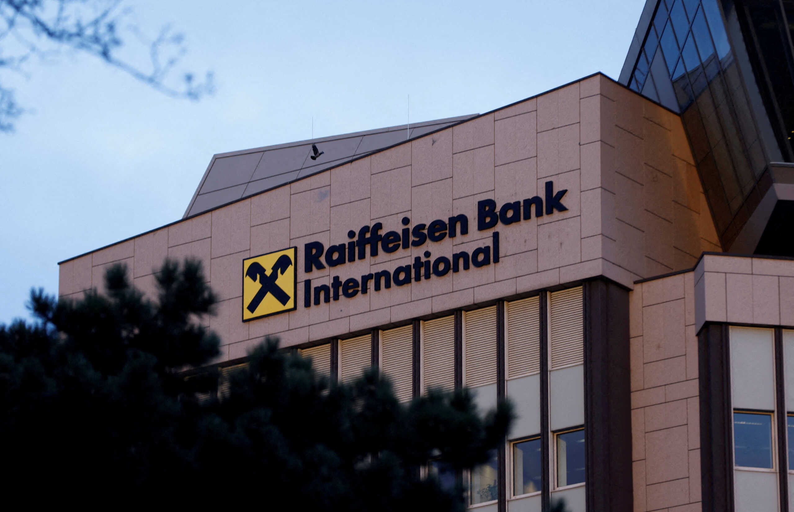 FILE PHOTO: The logo of Raiffeisen Bank International (RBI) is seen on their headquarters in Vienna, Austria, March 14, 2023. REUTERS