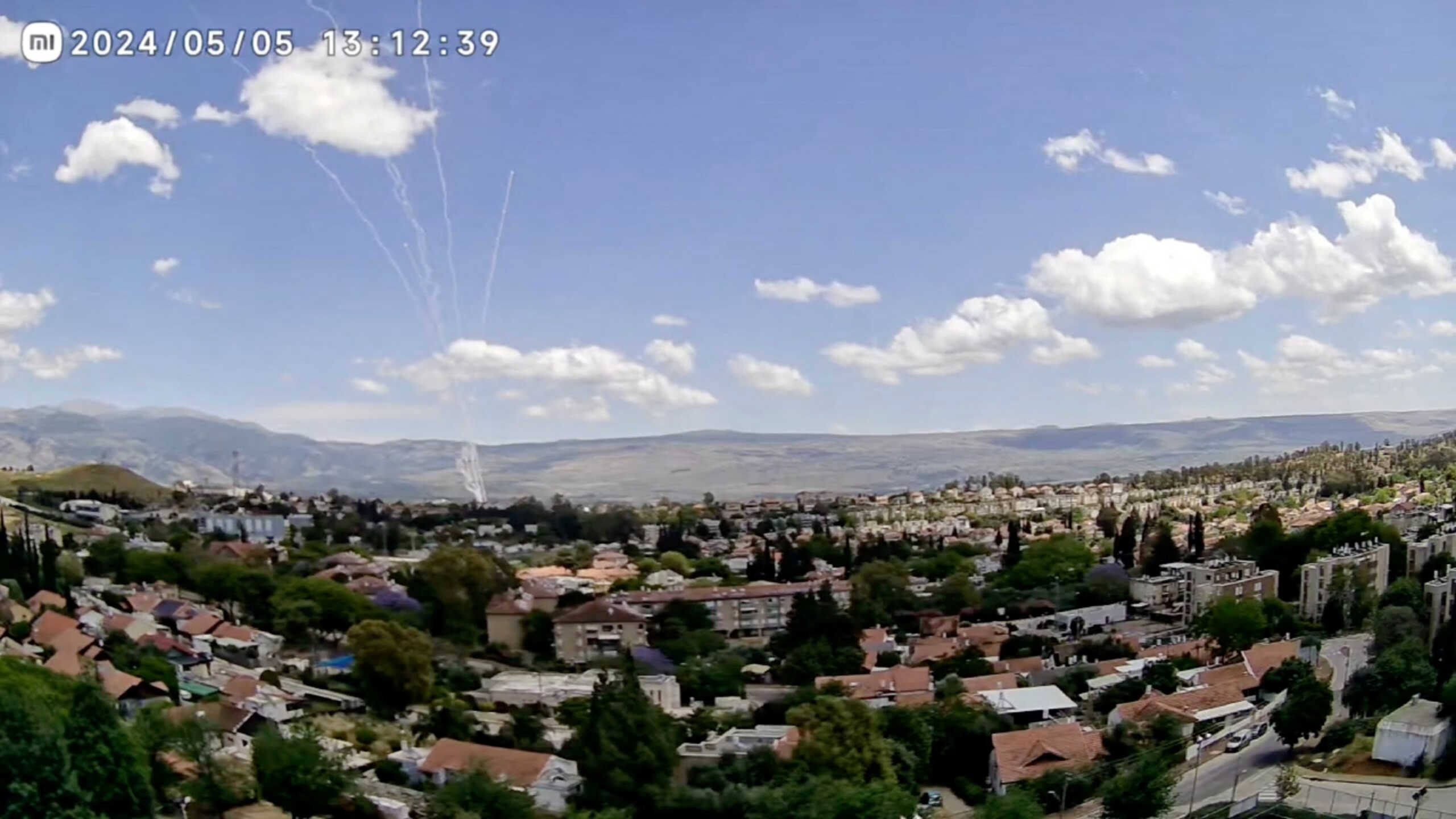 CCTV footage shows a barrage of rockets being fired from Lebanon, as seen from Kiryat Shmona, Israel, May 5, 2024 in this still image taken from video.   Obtained by Reuters