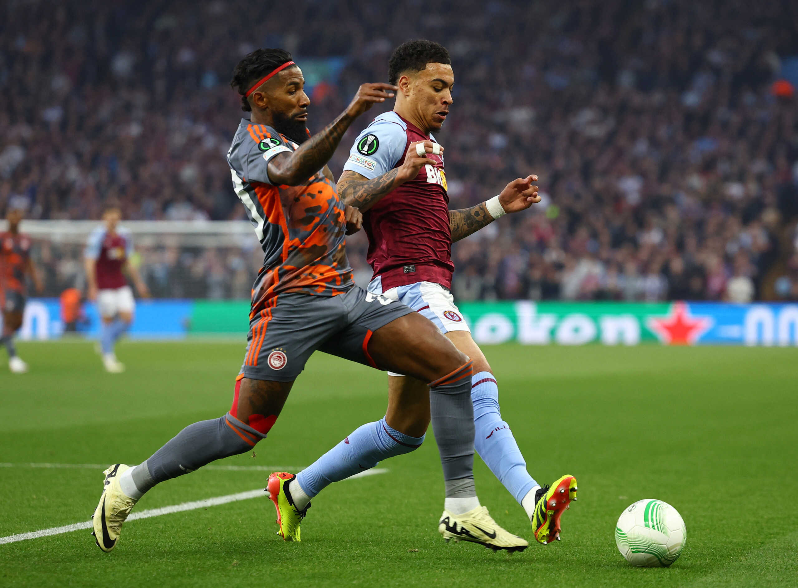 Soccer Football - Europa Conference League - Semi Final - First Leg - Aston Villa v Olympiacos - Villa Park, Birmingham, Britain - May 2, 2024  Aston Villa's Morgan Rogers in action with Olympiacos' Rodinei Action Images via Reuters