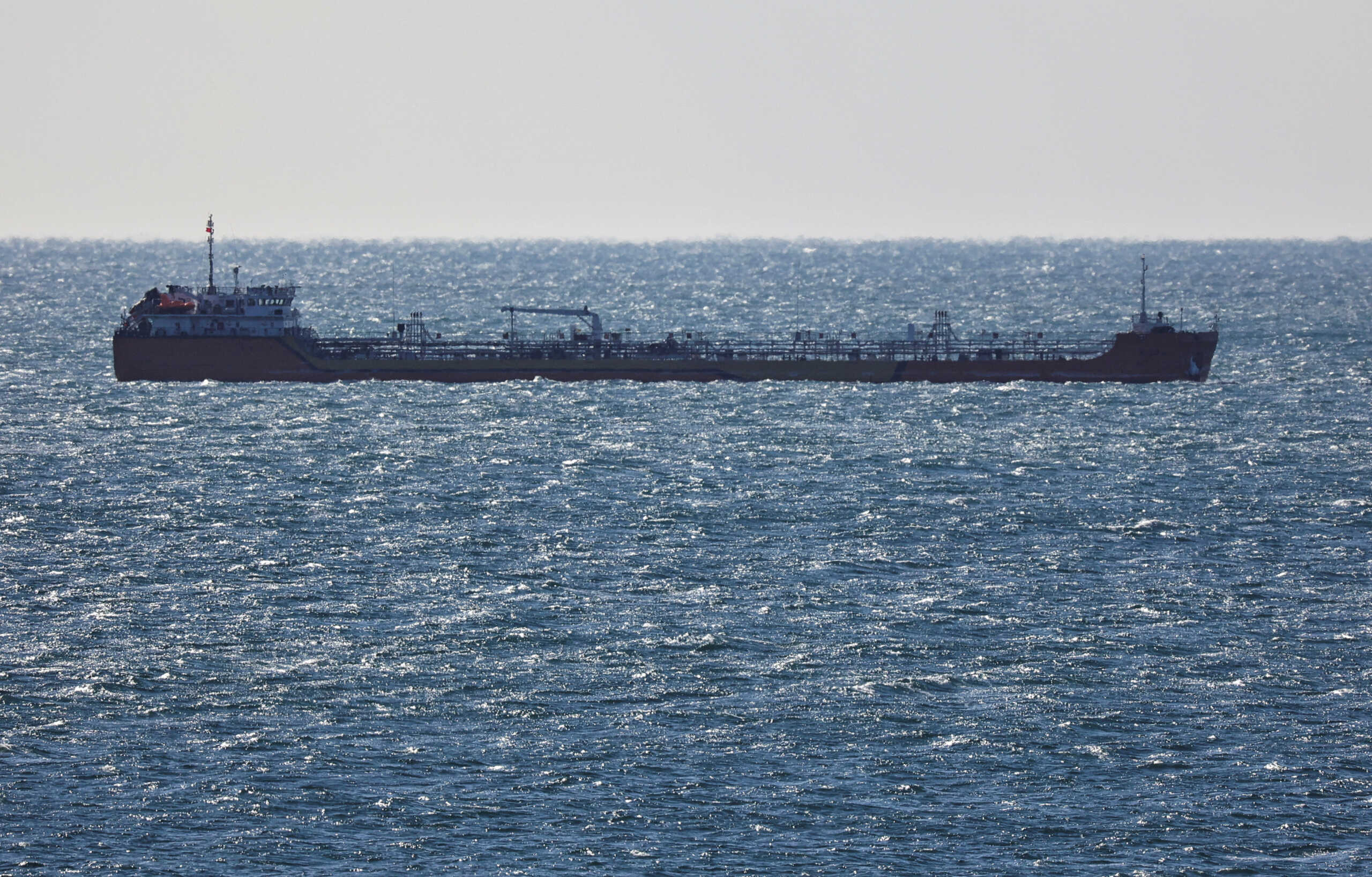 FILE PHOTO: A crude oil tanker sails in Nakhodka Bay near the port city of Nakhodka, Russia, December 4, 2022. REUTERS
