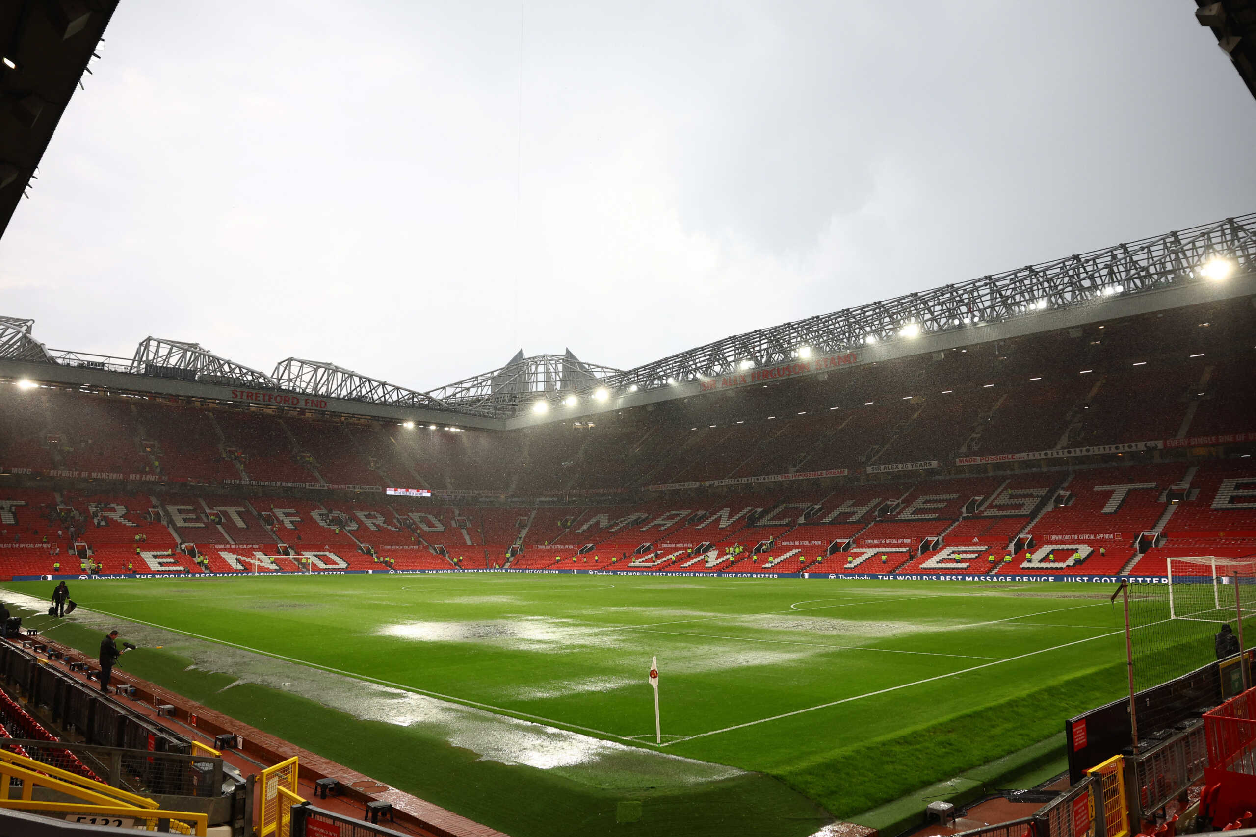 Soccer Football - Premier League - Manchester United v Arsenal - Old Trafford, Manchester, Britain - May 12, 2024 General view of rain fall pooling on the pitch after the match REUTERS