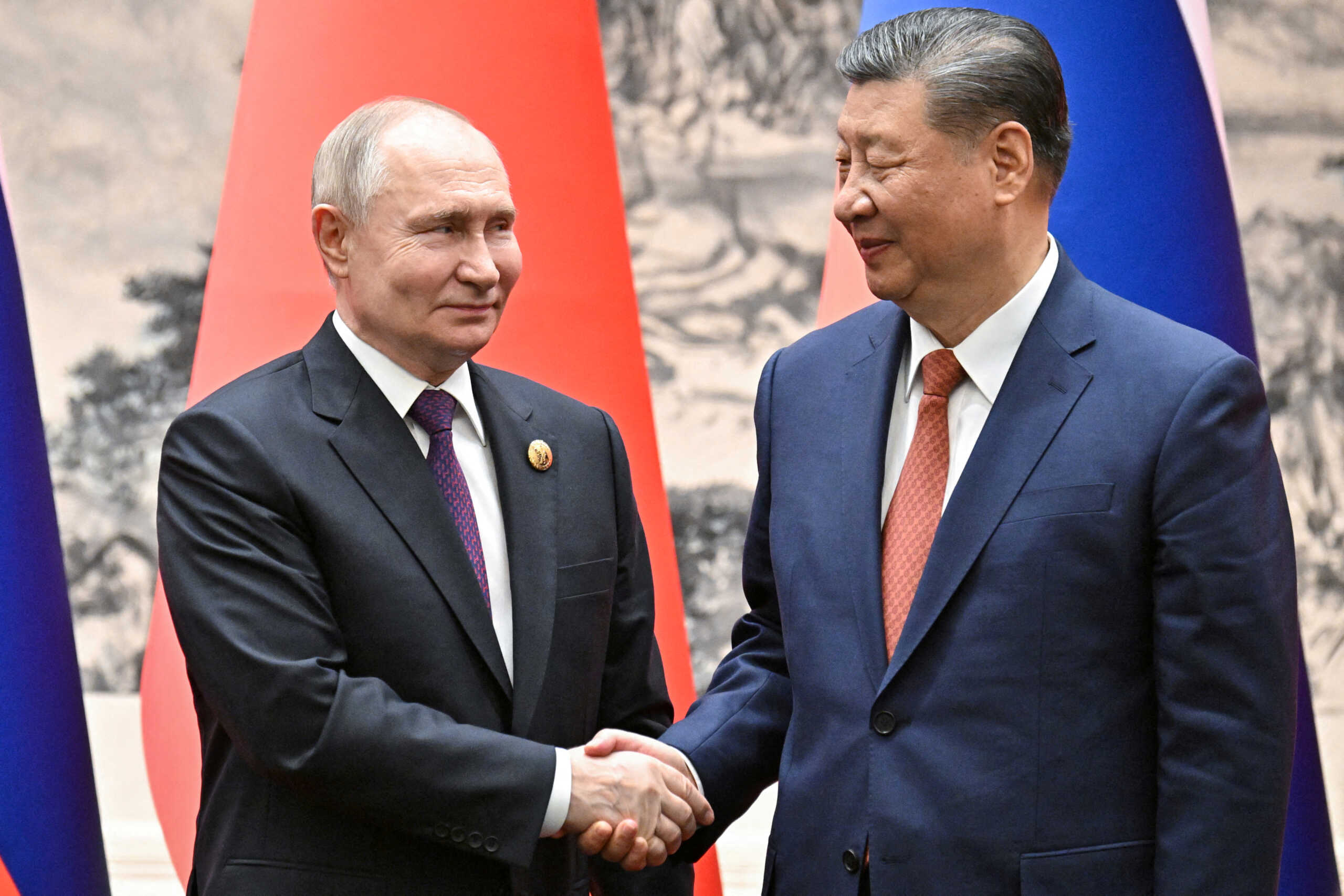 Russian President Vladimir Putin shakes hands with Chinese President Xi Jinping during a meeting in Beijing, China May 16, 2024. Sputnik