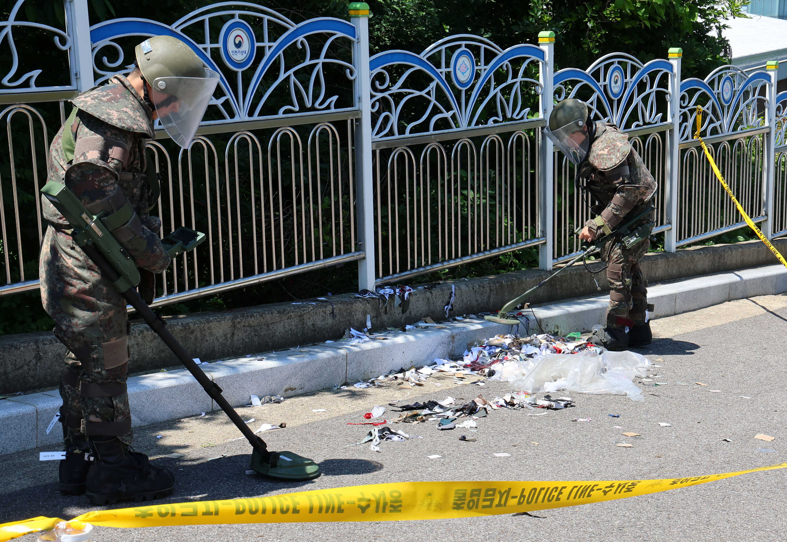 South Korean soldiers examine various objects including what appeared to be trash from a balloon believed to have been sent by North Korea, in Incheon, South Korea, June 2, 2024.     Yonhap via REUTERS   THIS IMAGE HAS BEEN SUPPLIED BY A THIRD PARTY. NO RESALES. NO ARCHIVES. SOUTH KOREA OUT. NO COMMERCIAL OR EDITORIAL SALES IN SOUTH KOREA.