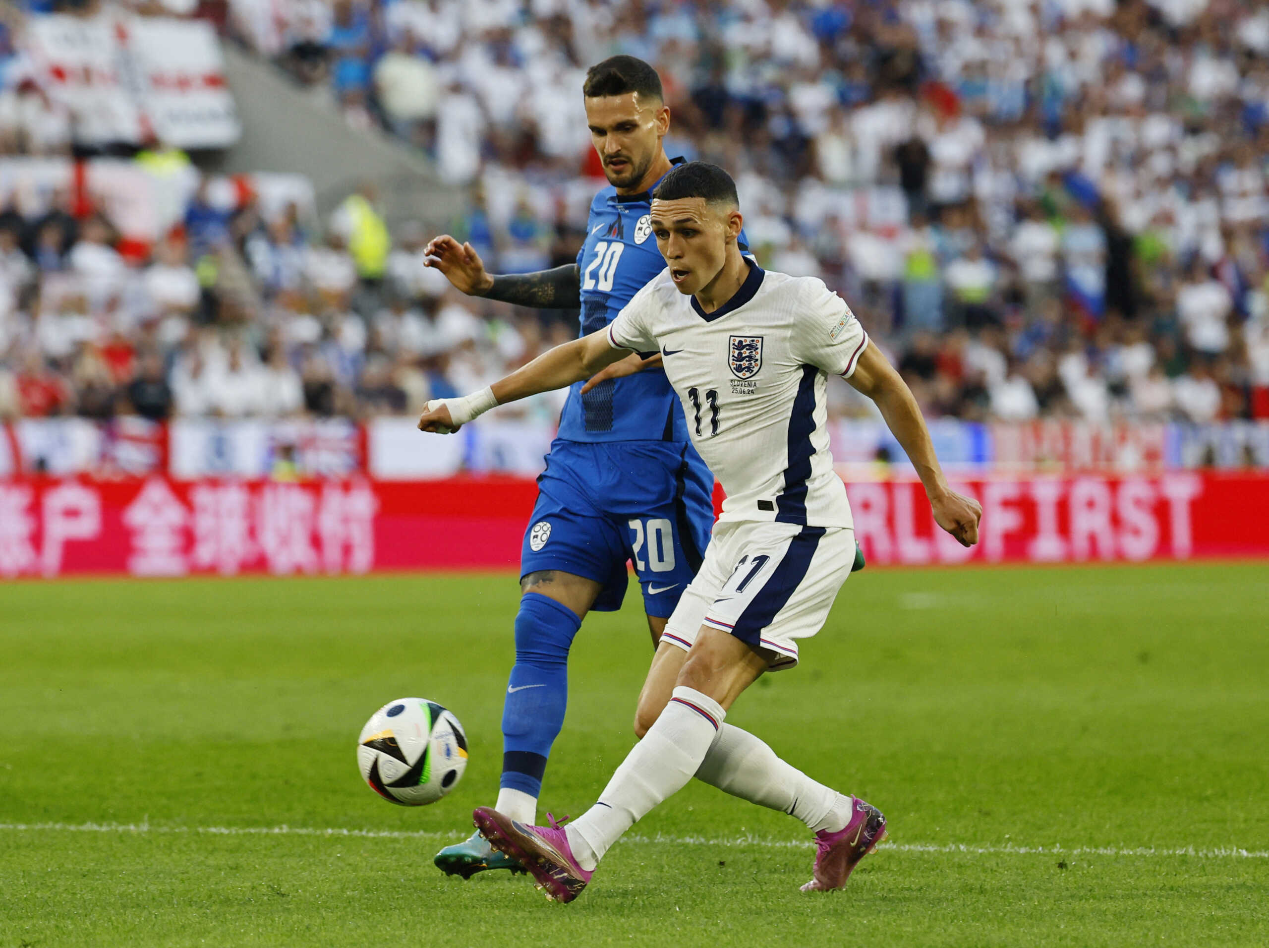Soccer Football - Euro 2024 - Group C - England v Slovenia - Cologne Stadium, Cologne, Germany - June 25, 2024  Slovenia's Petar Stojanovic in action with England's Phil Foden REUTERS