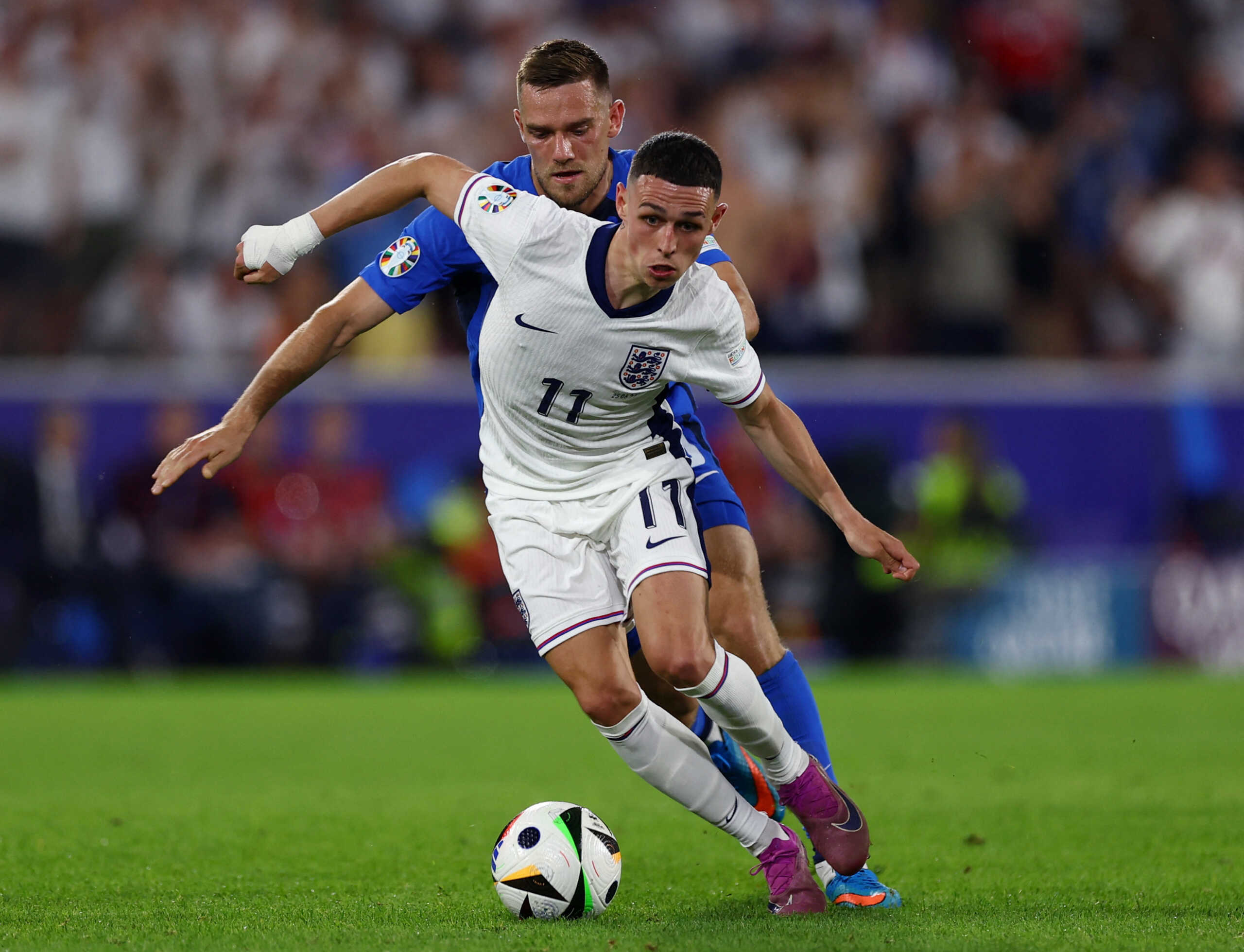Soccer Football - Euro 2024 - Group C - England v Slovenia - Cologne Stadium, Cologne, Germany - June 25, 2024  England's Phil Foden in action with Slovenia's Timi Max Elsnik REUTERS