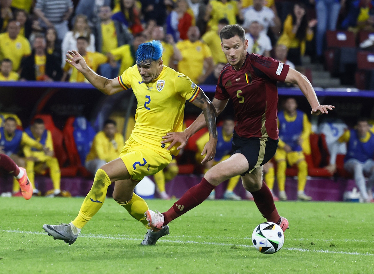 Soccer Football - Euro 2024 - Group E - Belgium v Romania - Cologne Stadium, Cologne, Germany - June 22, 2024 Romania's Andrei Ratiu in action with Belgium's Jan Vertonghen REUTERS